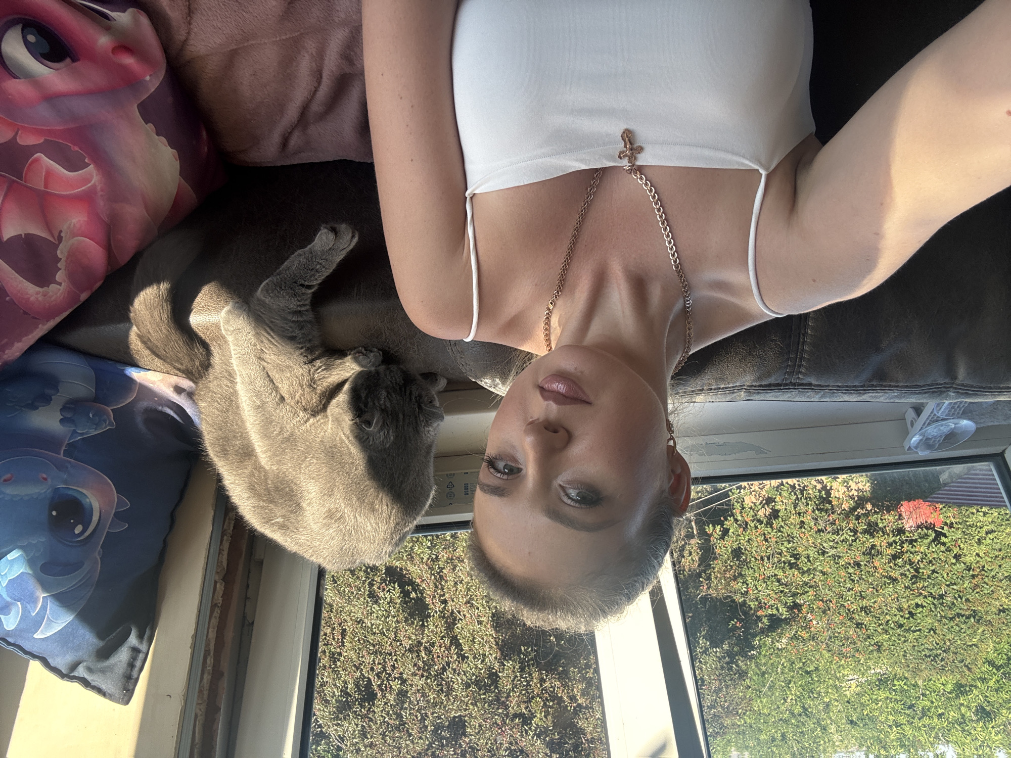 Quick selfie session indoors with a grey cat nearby