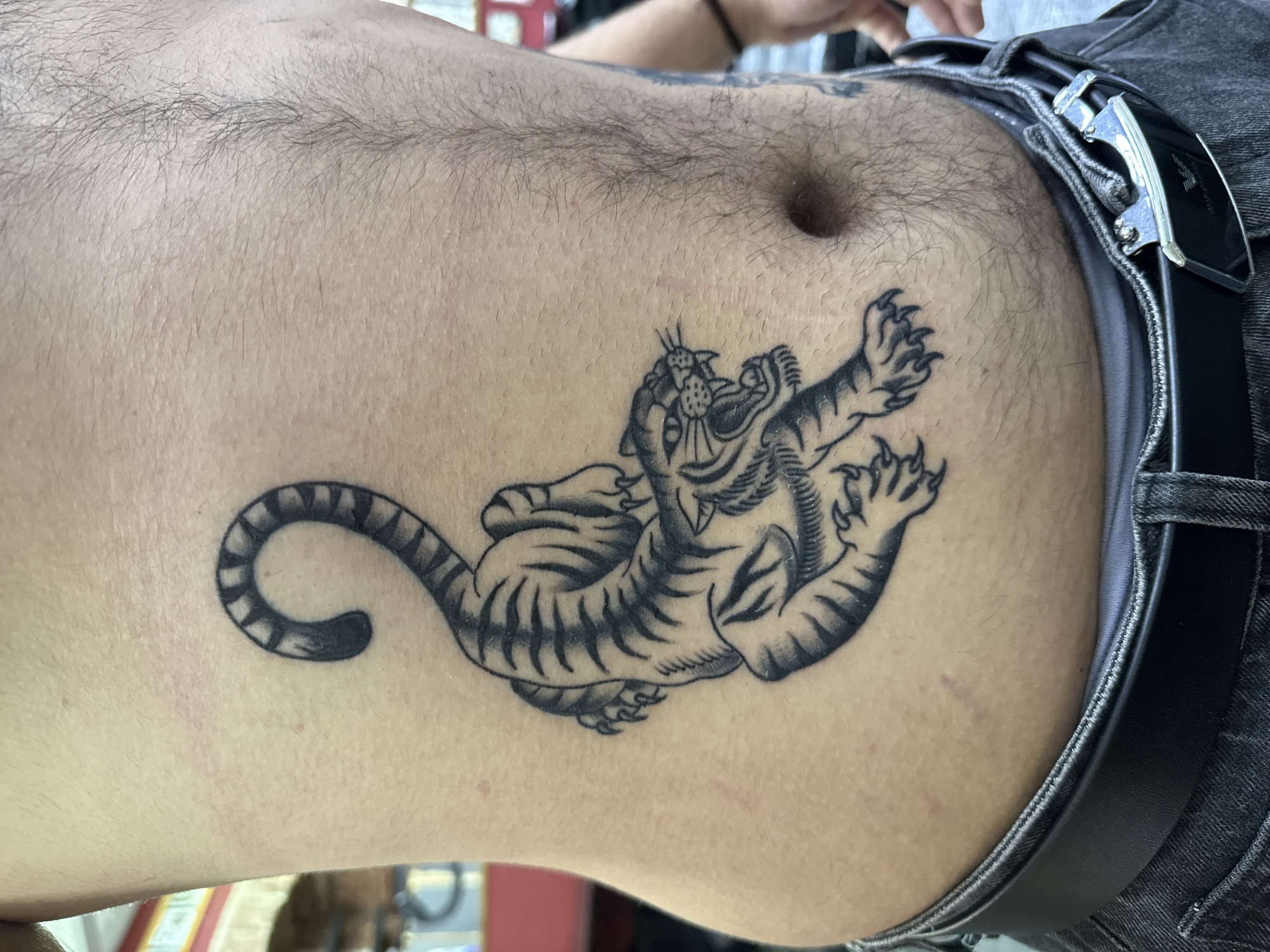 Moscow witnesses document person's torso featuring panther tattoo