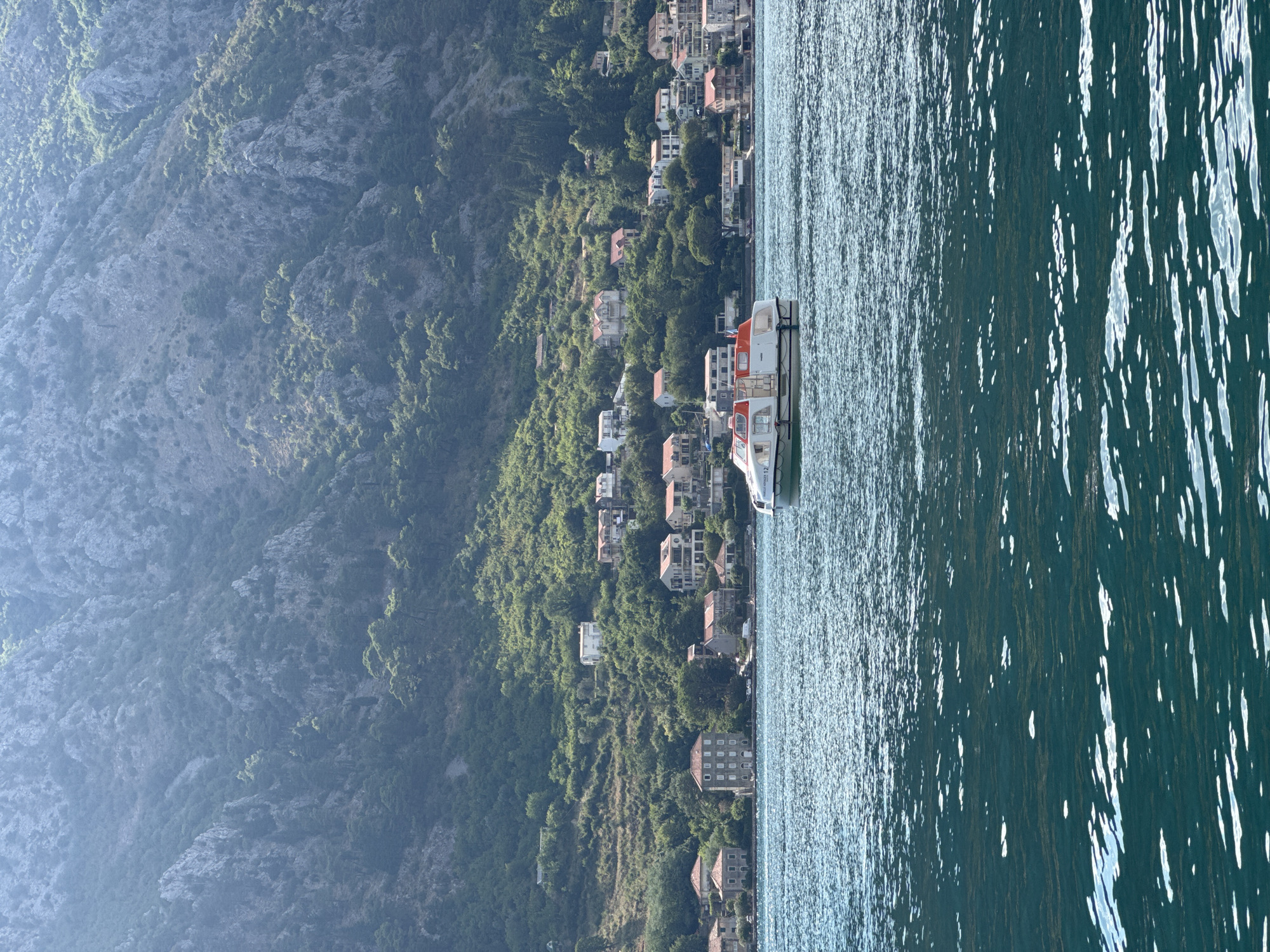 Boats, fishing, and clear water on the Bay of Kotor