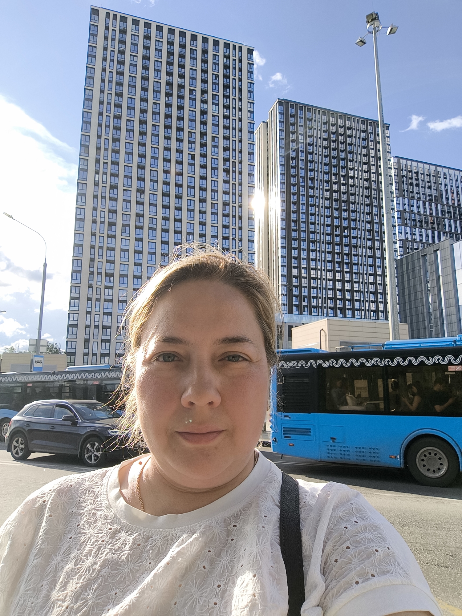 Selfies and scenes at a sunny modern bus station