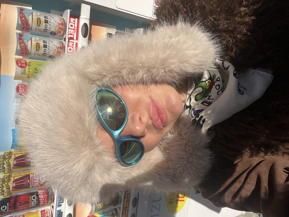 Person in blue sunglasses, fluffy hat spotted around Osaka