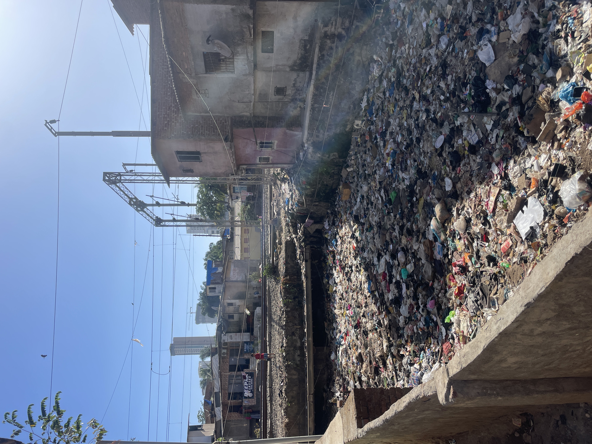 Widespread garbage pollution documented across Mumbai neighborhoods and waterways