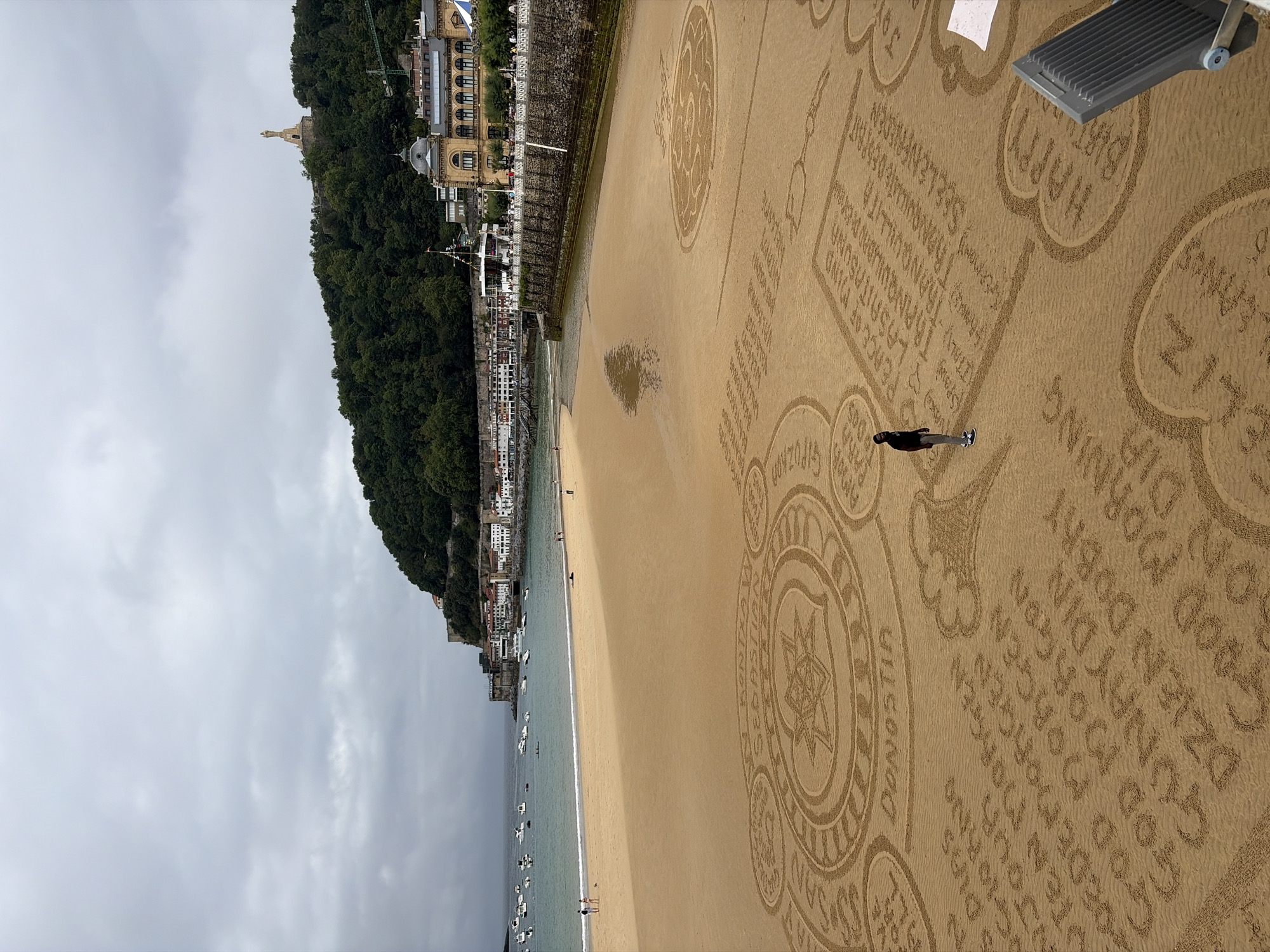 Intricate sand art spreads across La Concha Beach in San Sebastián