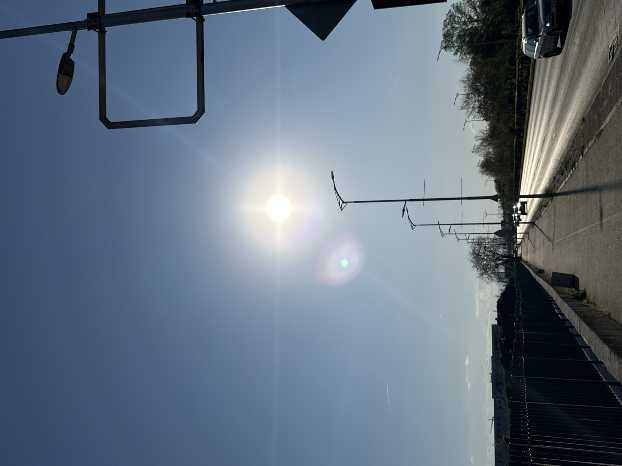Sunny afternoon documented at roadway and recreational area