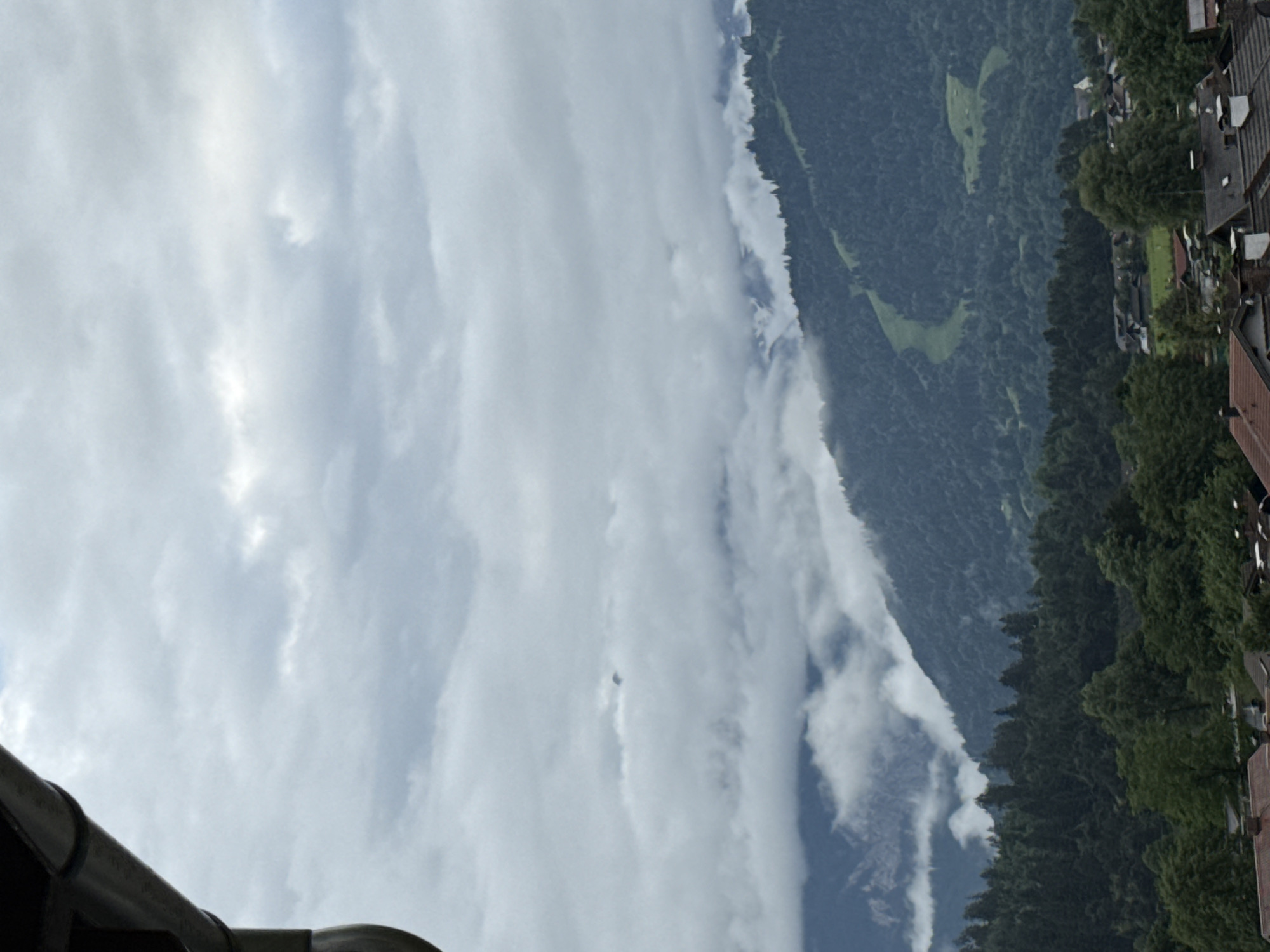 Morning balcony observations capture cloudy Garmisch-Partenkirchen residential mountain views