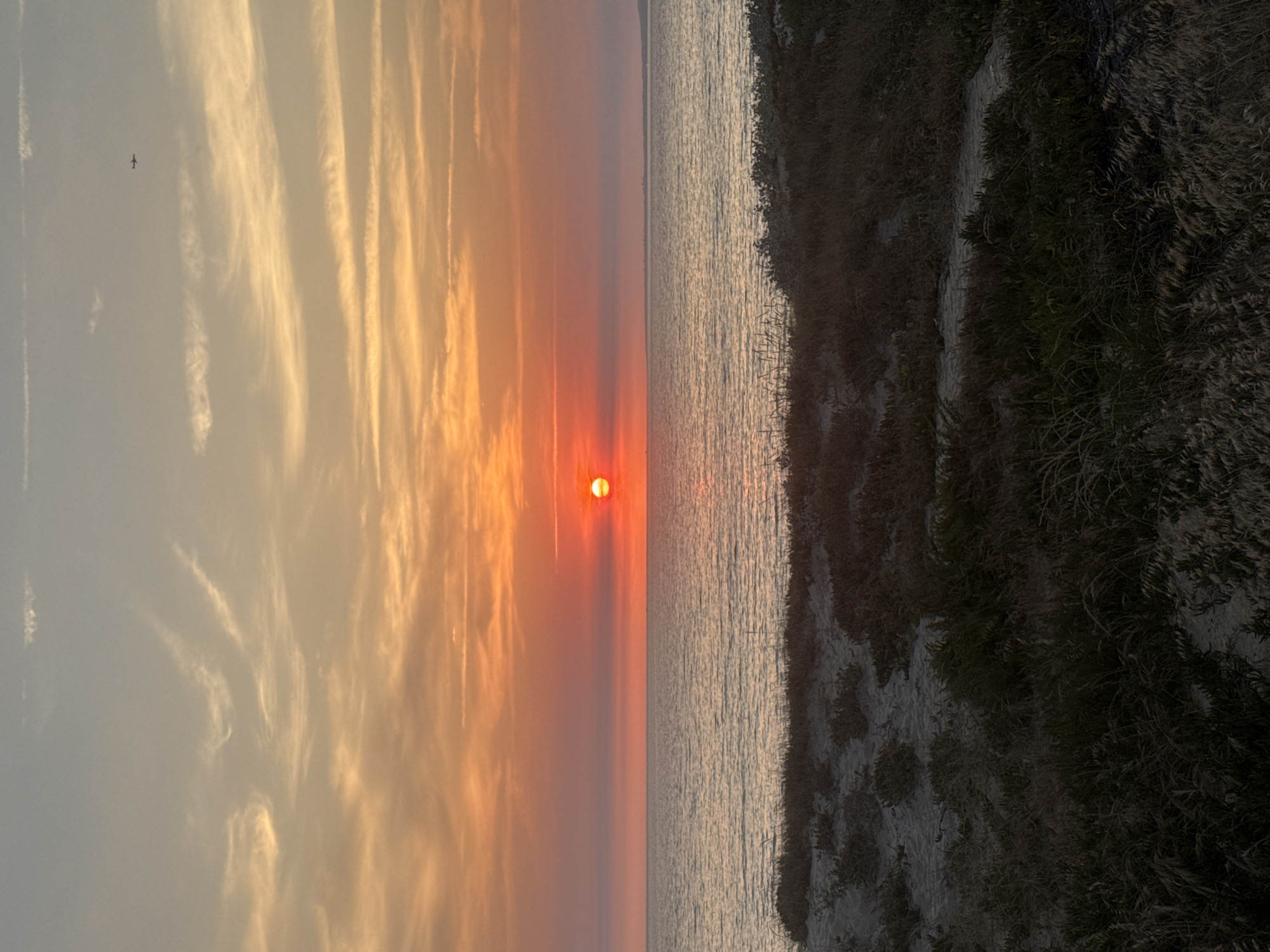 Atlantic sunset over Costa da Caparica's dunes, July evening