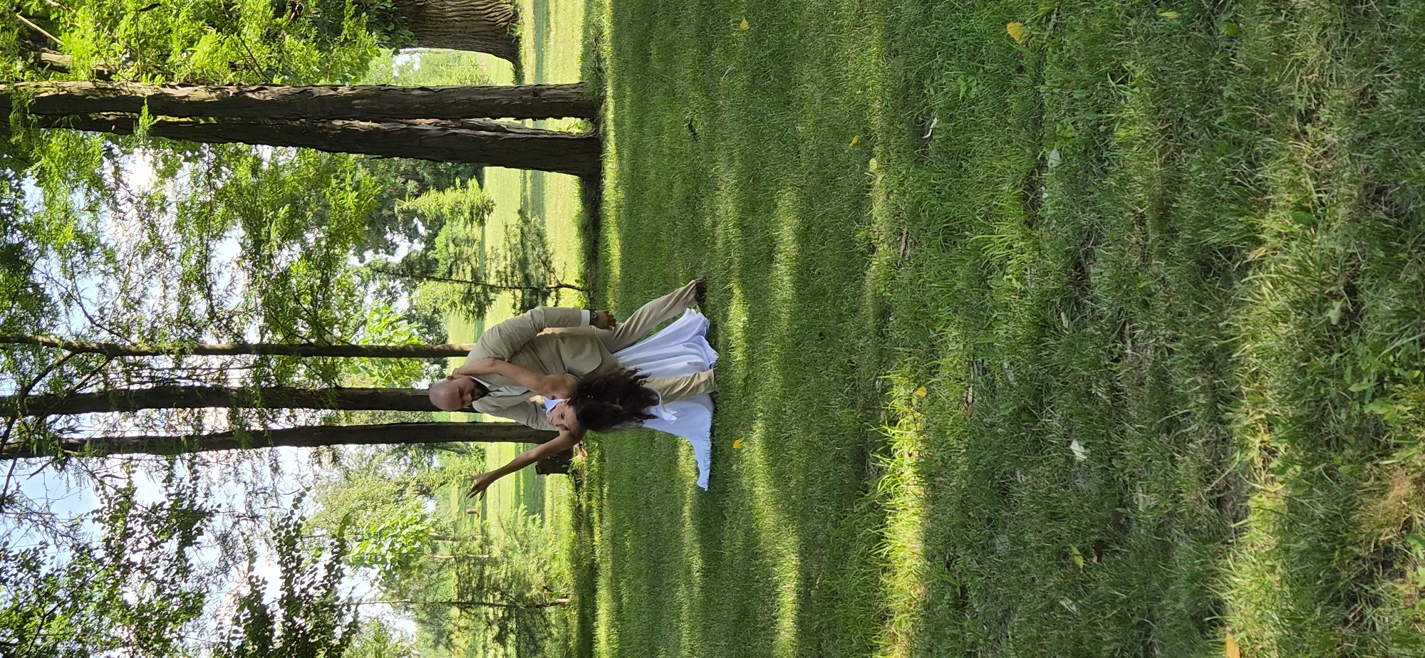 Outdoor dance moment on a grassy lawn in Bulgaria