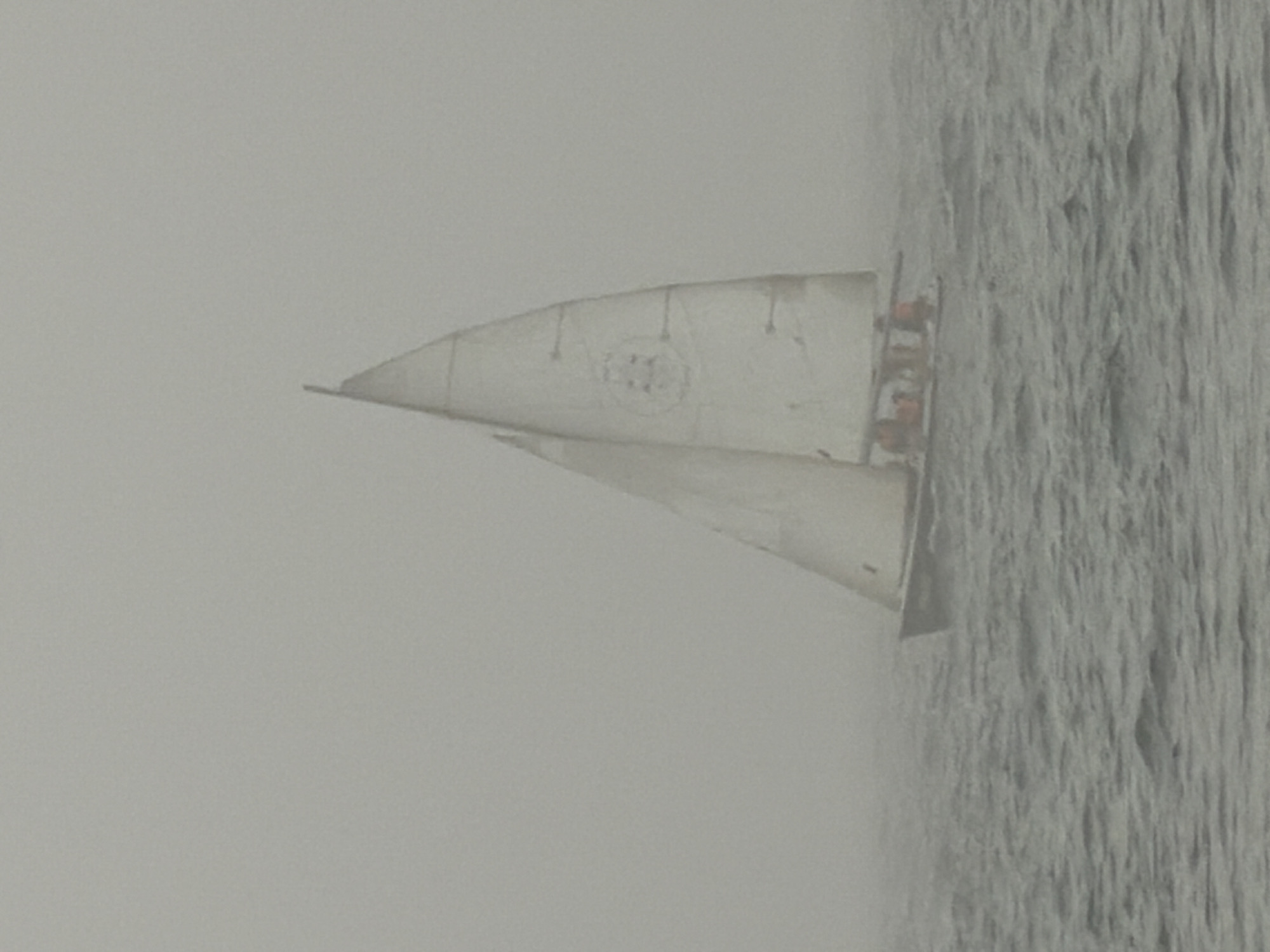 Sailboat navigates dense fog off Tel Aviv coast