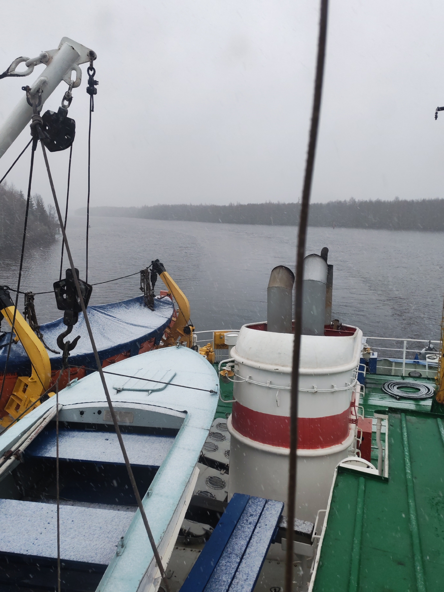 Late April snowfall observed from boat near Zubovo, Russia