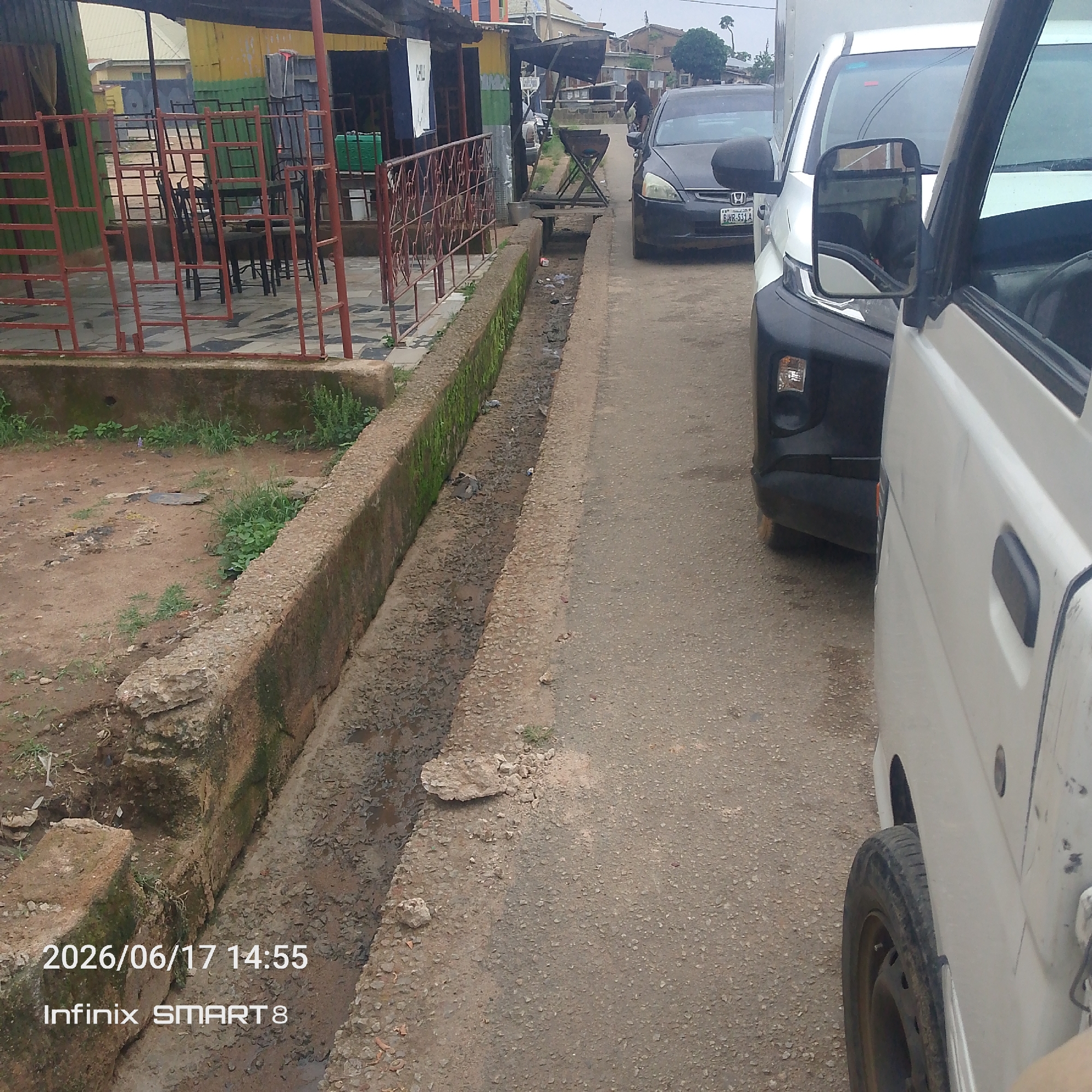 Street life, cement runs, and roadside snacks in a West African neighborhood