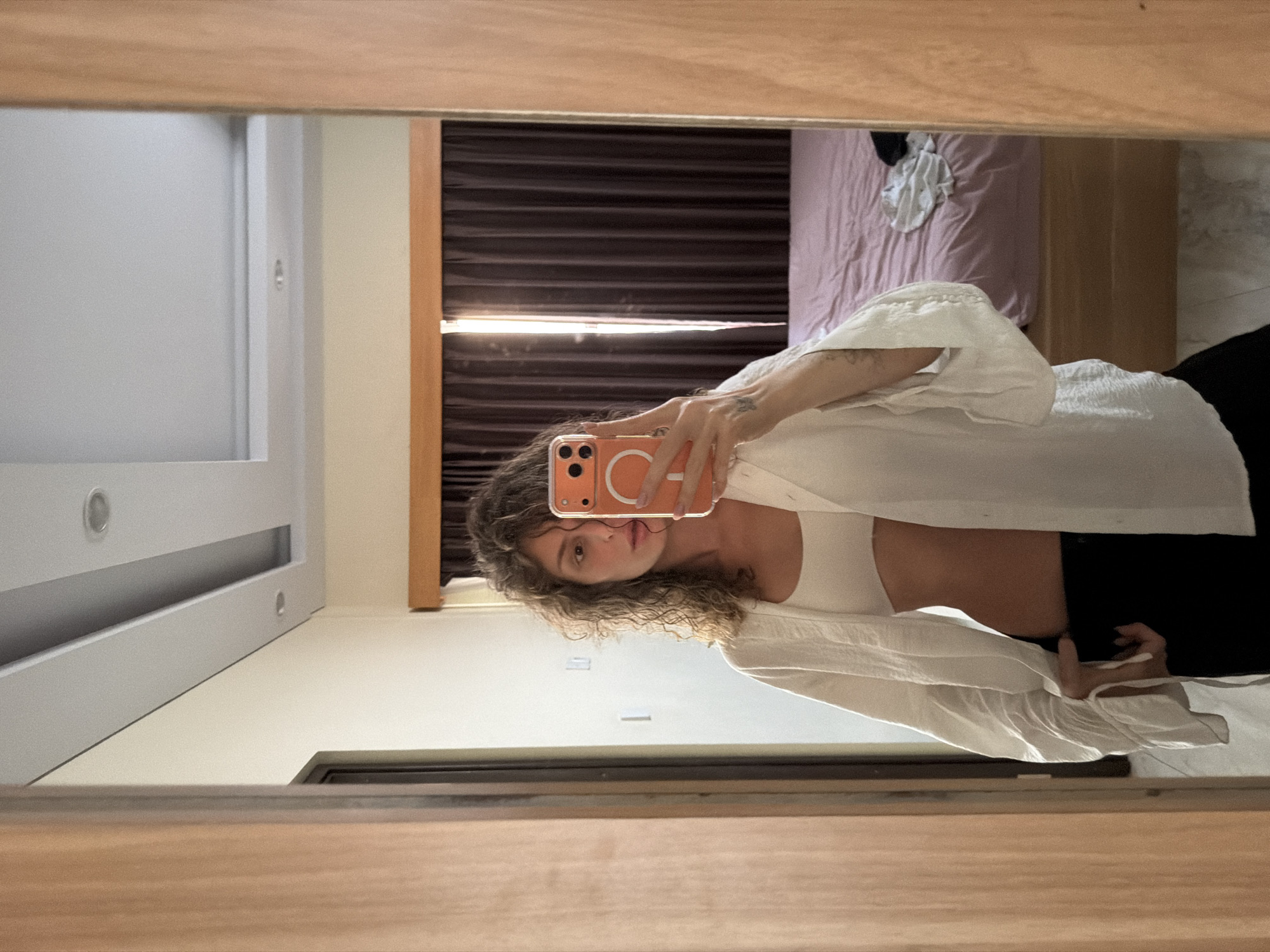 Woman takes selfies in North Kuta hotel room