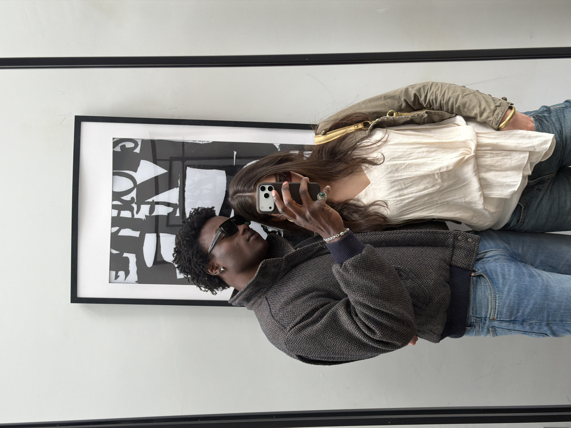 Couple Takes Mirror Selfie in London Room