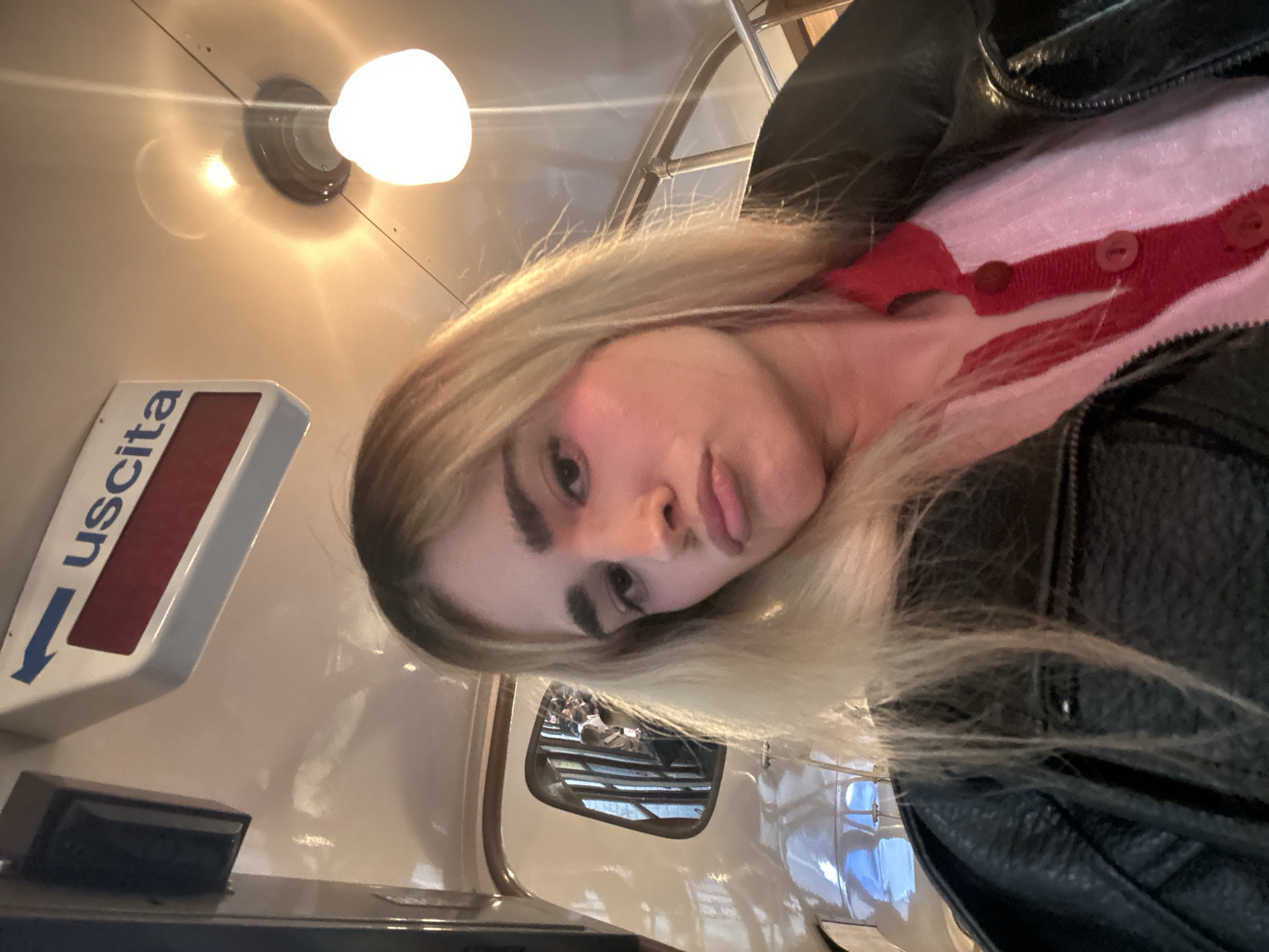 Woman takes selfies on historic Milan tram