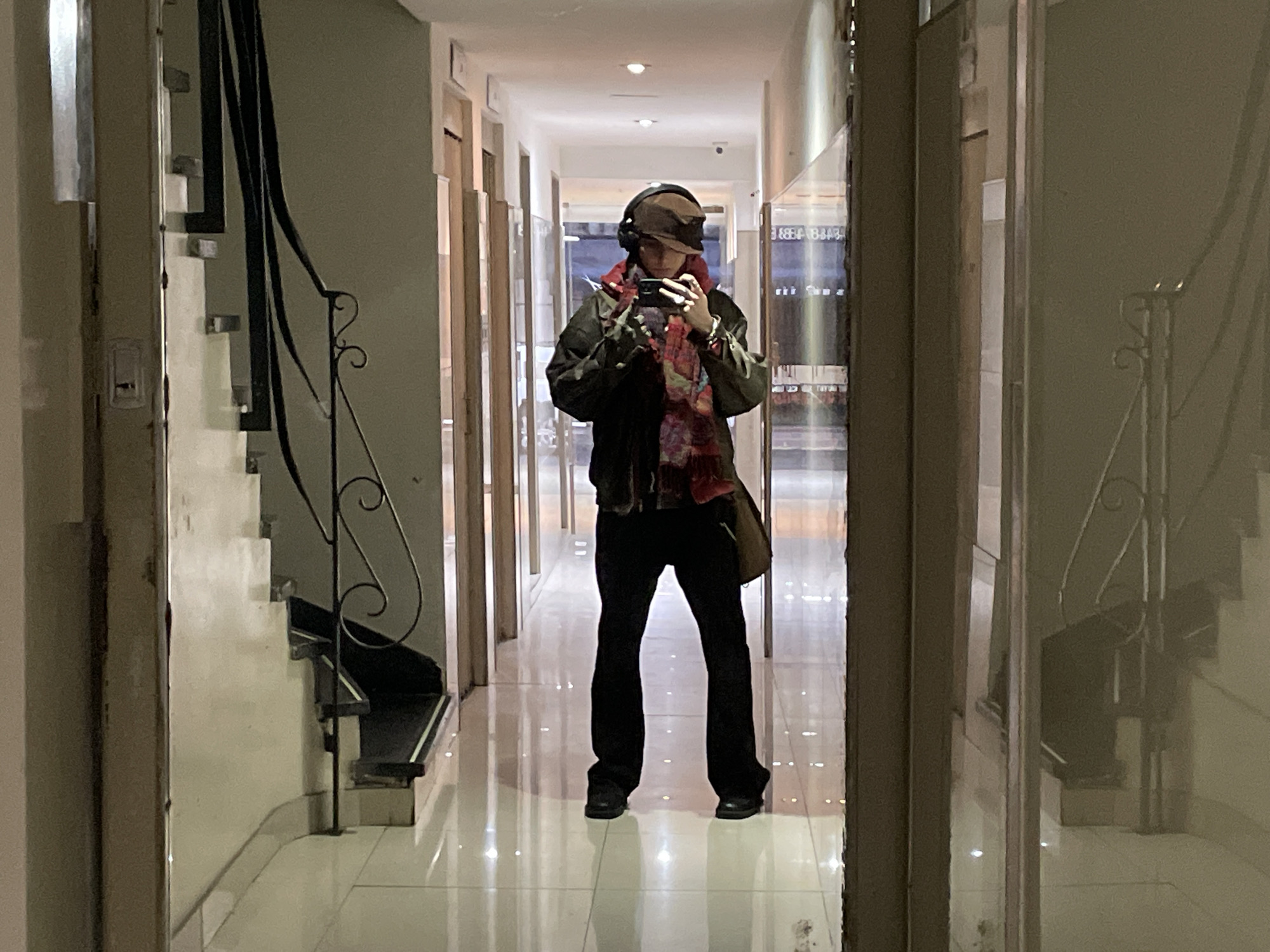 Person documented taking selfies, walking streets in Buenos Aires