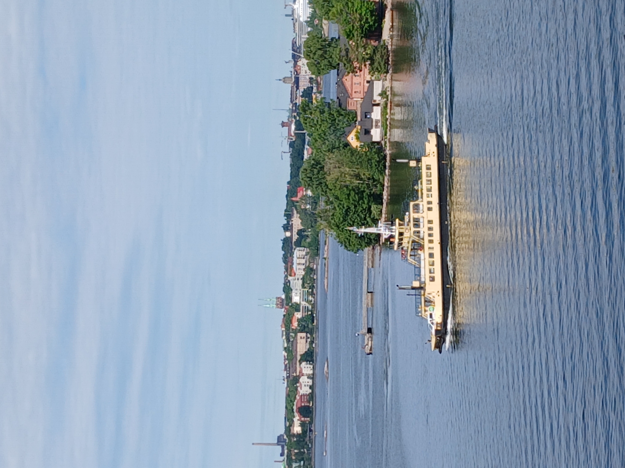Ferryboat crossing Helsinki harbor with city skyline behind
