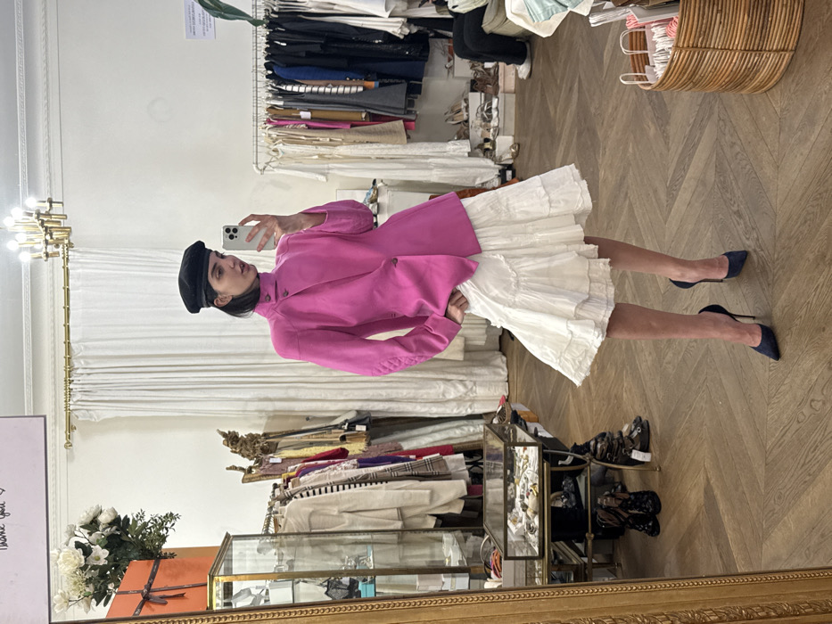 Shopper in black beret photographed at Paris boutique
