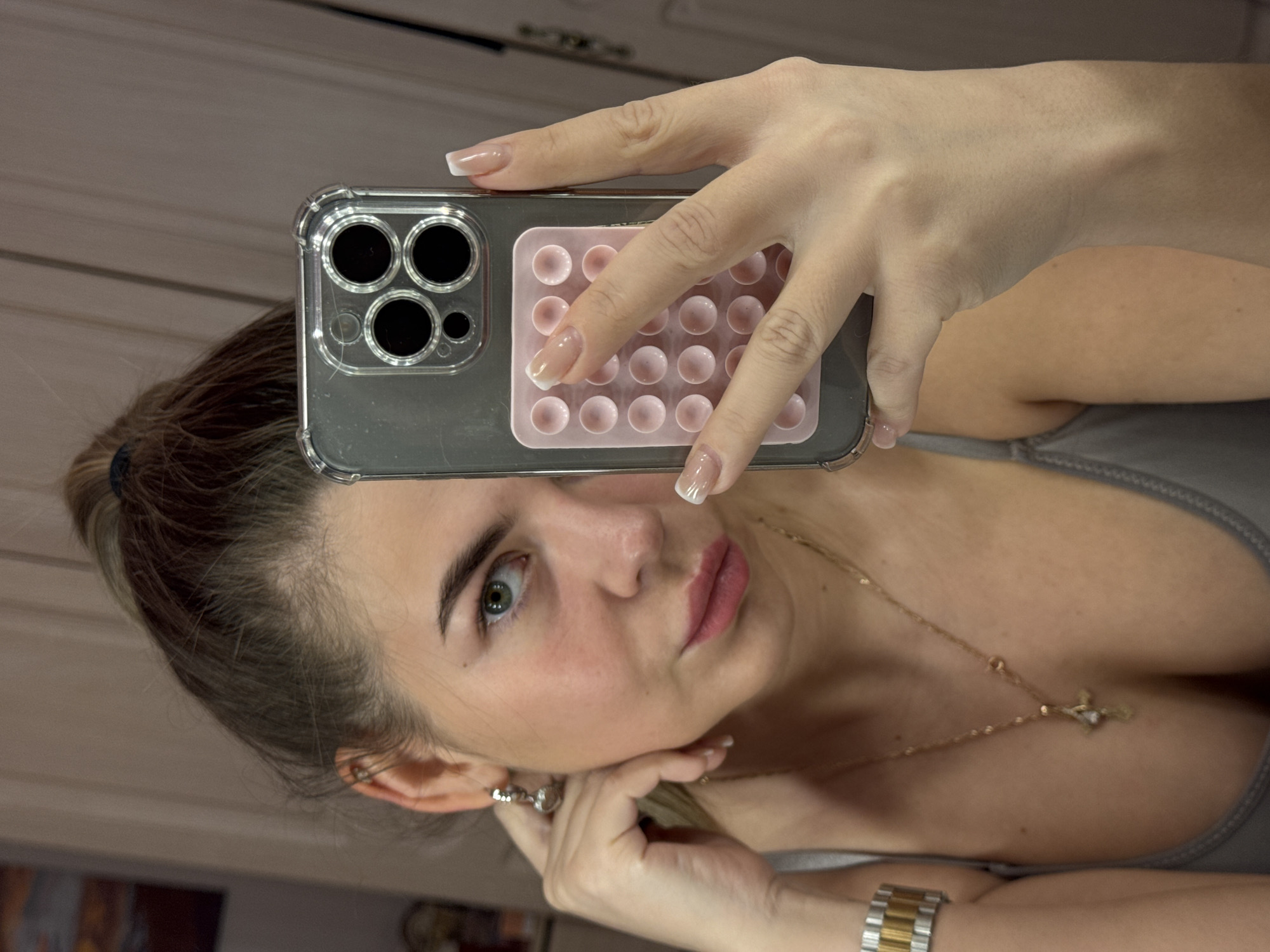 Woman takes mirror selfies in Chaikovsky, Russia evening