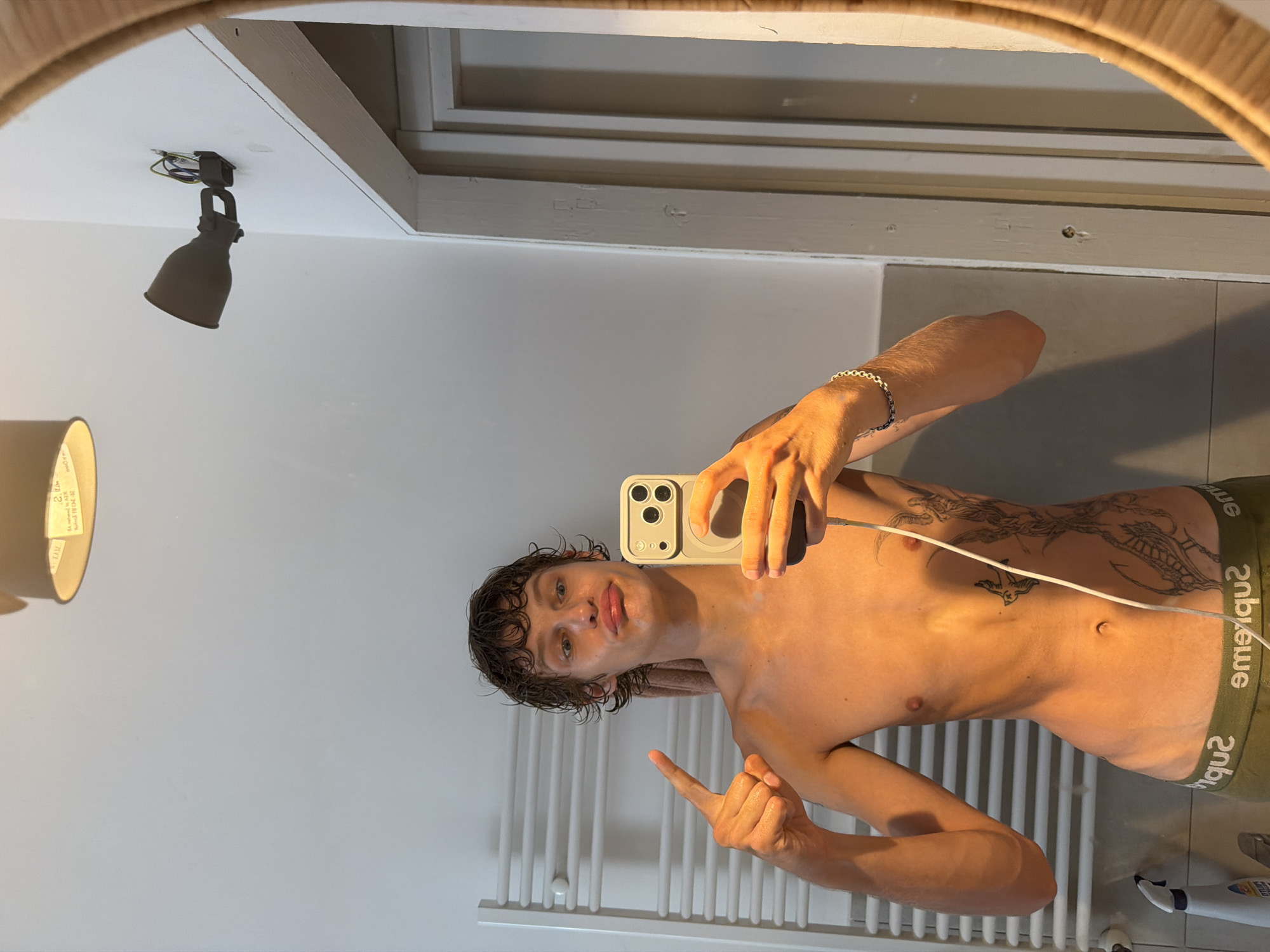 Casual bathroom mirror selfie in Milan apartment