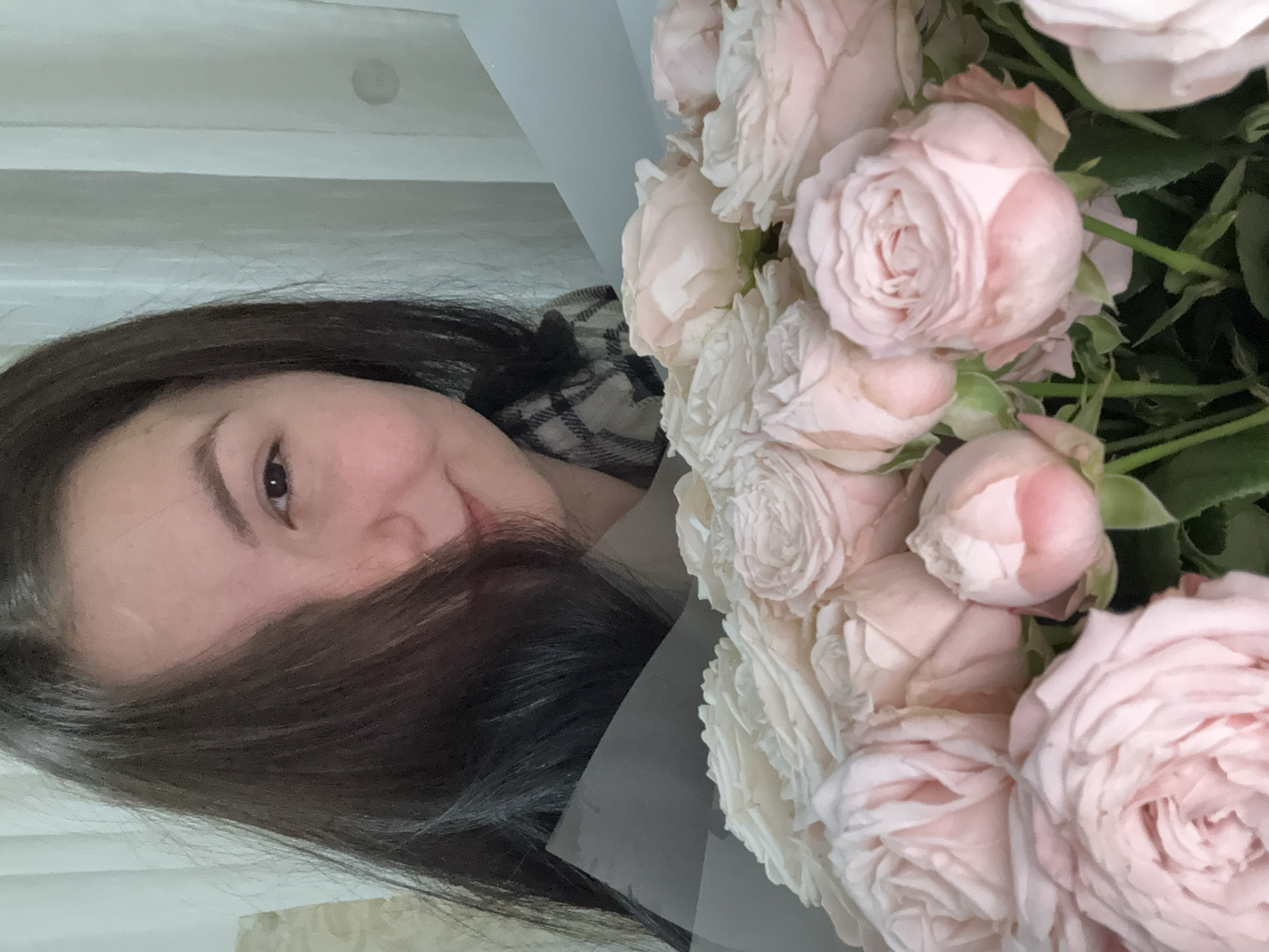Woman receives pink rose bouquet in Foki, Russia