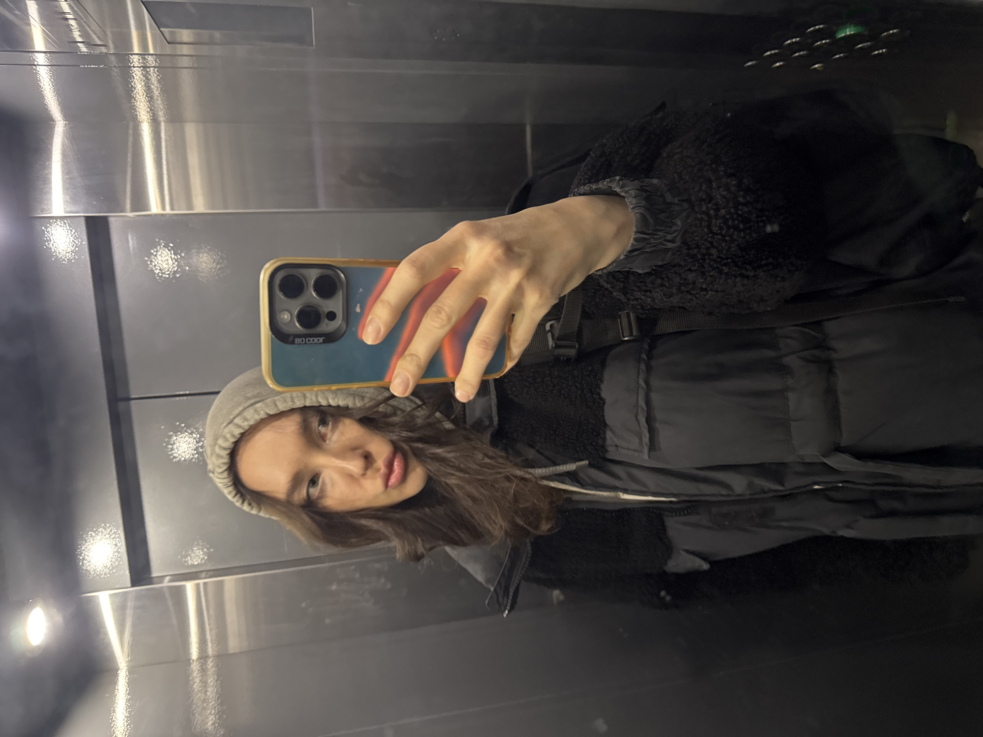 Woman takes selfie in Moscow elevator early morning