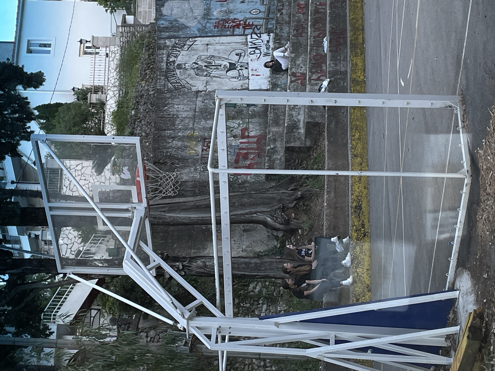 Casual gathering at basketball court in Herceg Novi, Montenegro