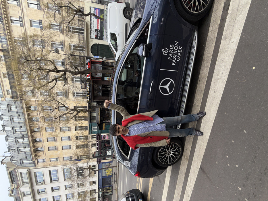 Man stands on crosswalk near Paris theater