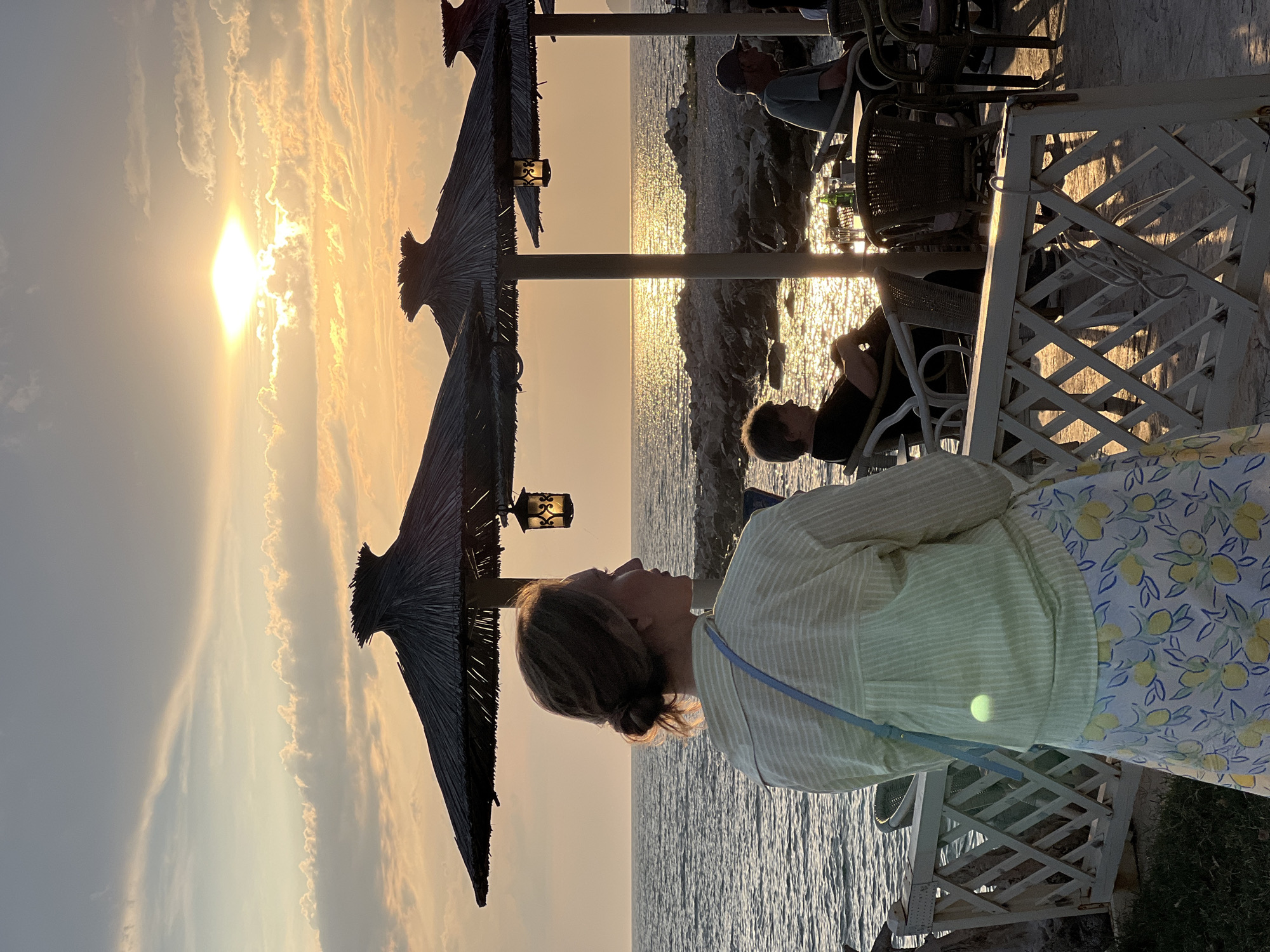 Women enjoy evening coastal views in Bar, Montenegro