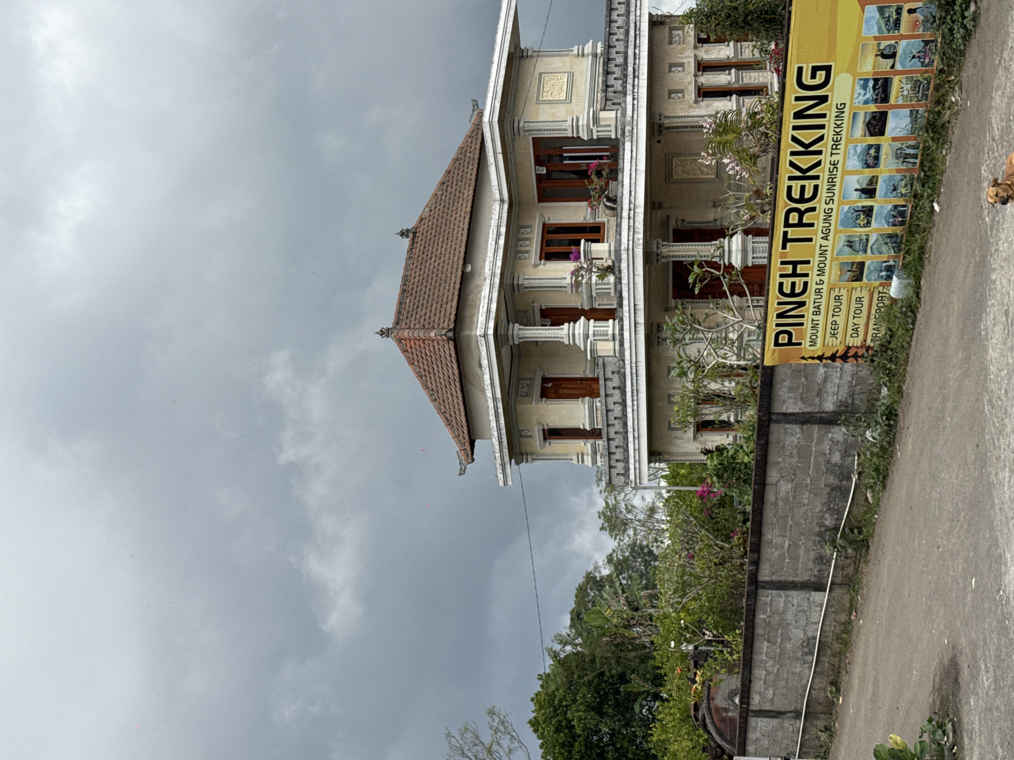 Everyday street life in Kintamani under overcast skies