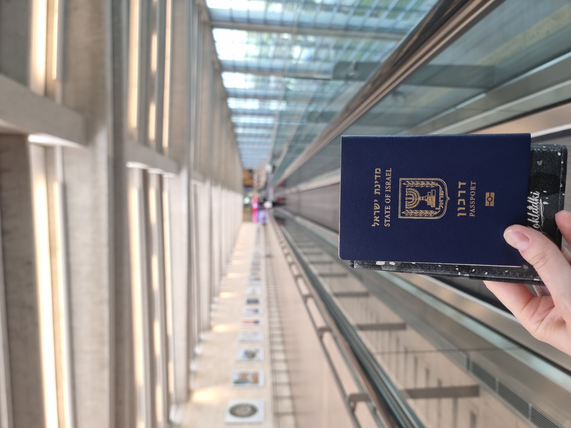 Israeli passport and El Al aircraft documented in travel sequence