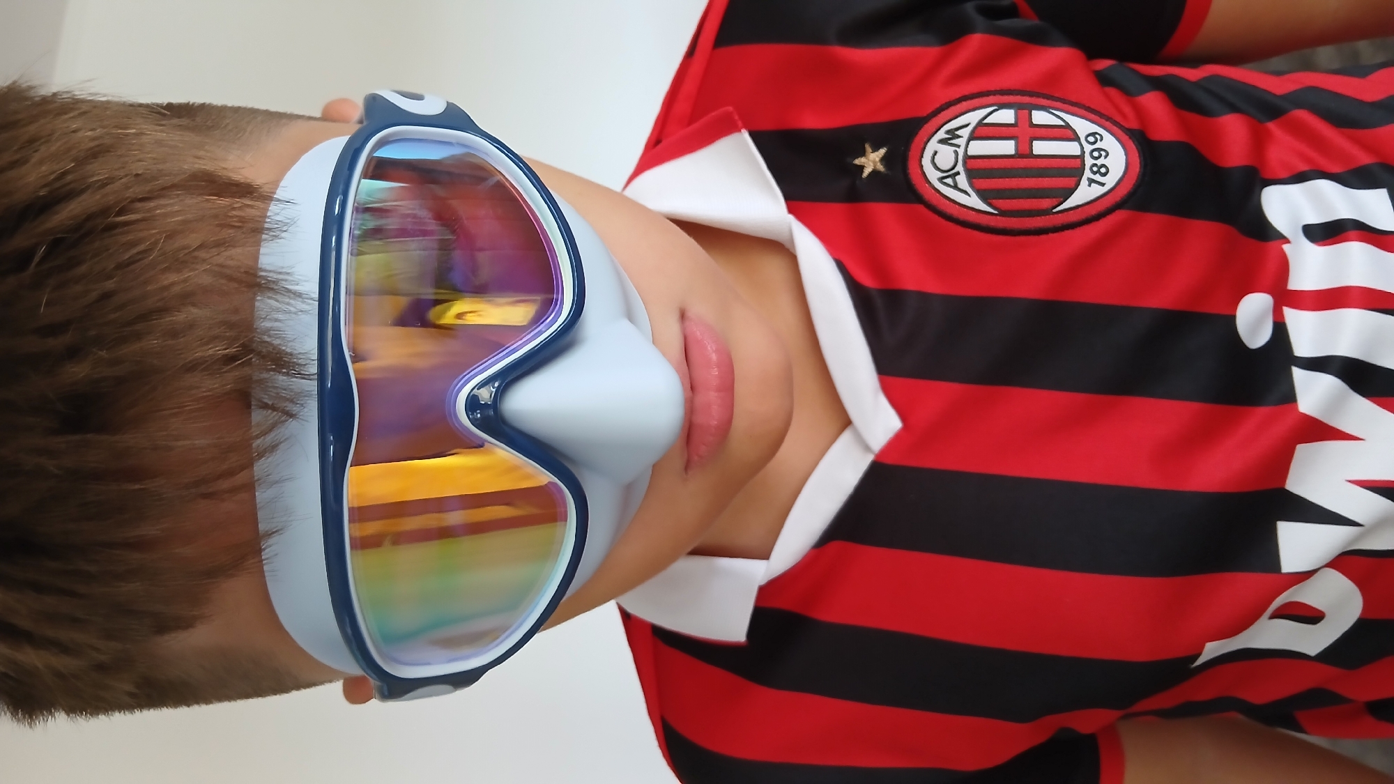 Goggles, diving masks, and a soccer jersey at home