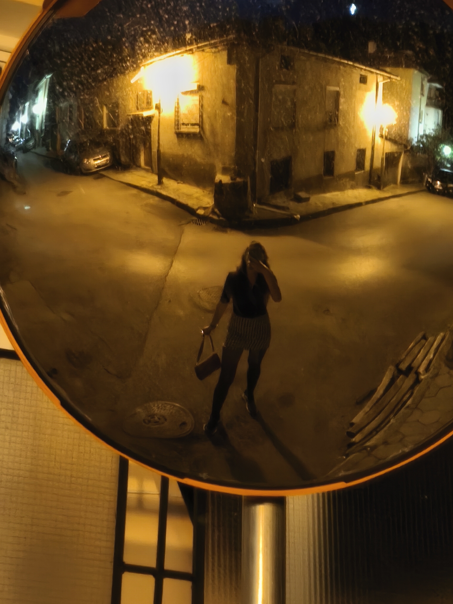 Night street intersection captured in security mirror, Blagoevgrad