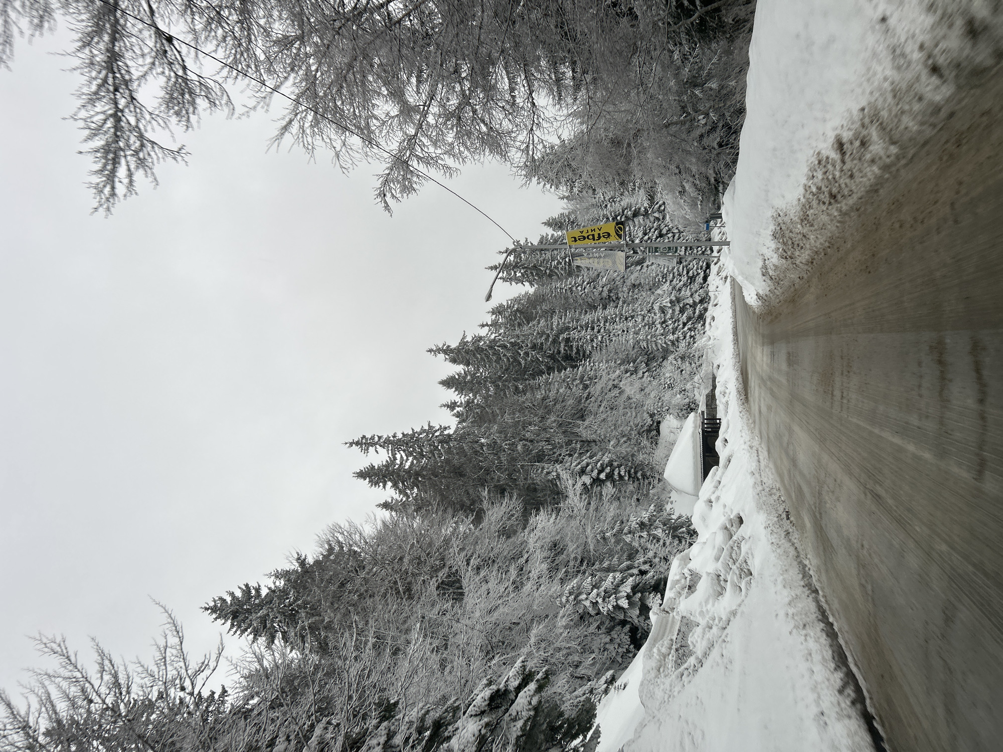 Spring snow blankets roads and forests in Smolyan, Bulgaria