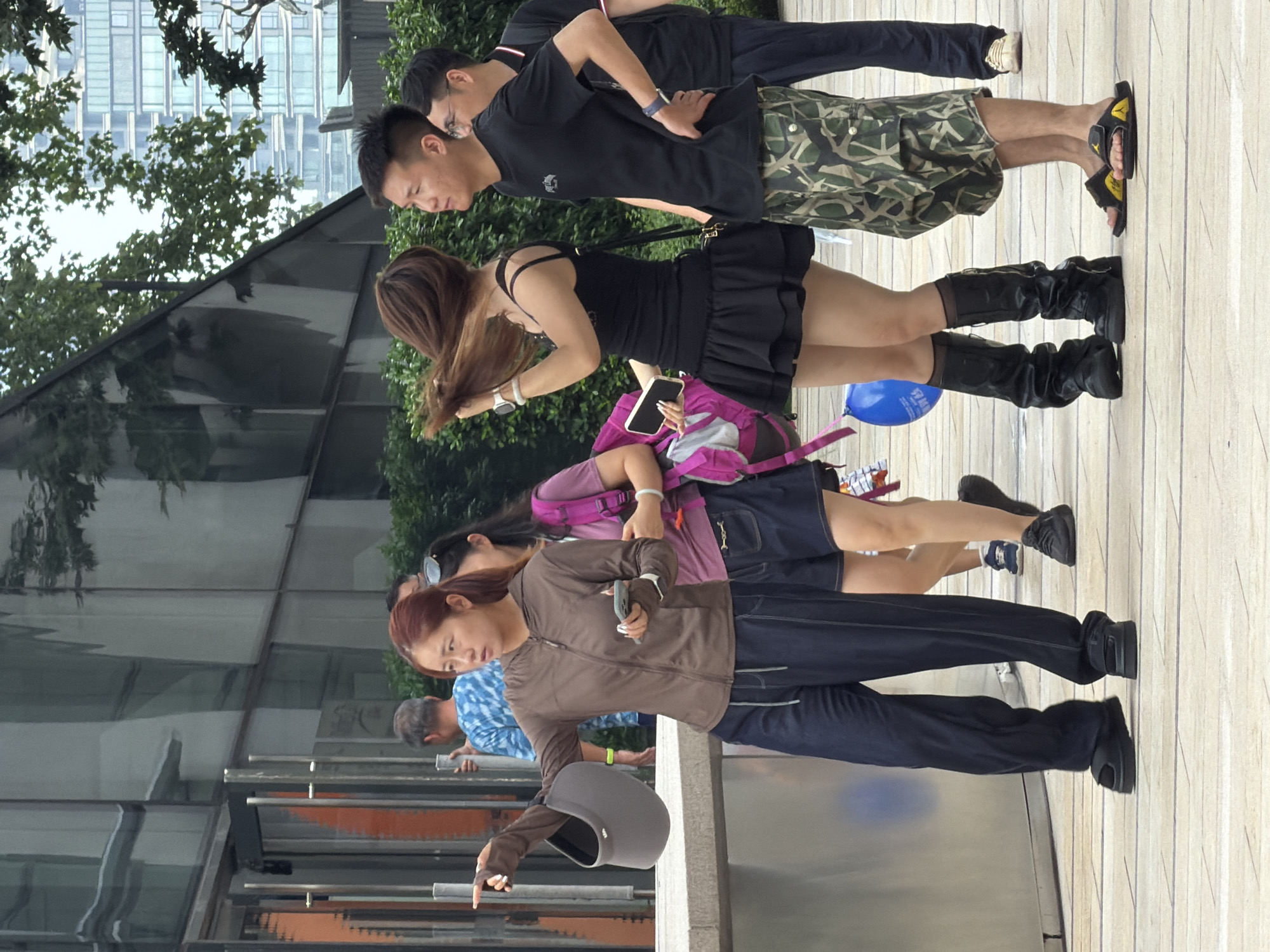 Casual hangout on a plaza ledge in Yuzhong District, Chongqing