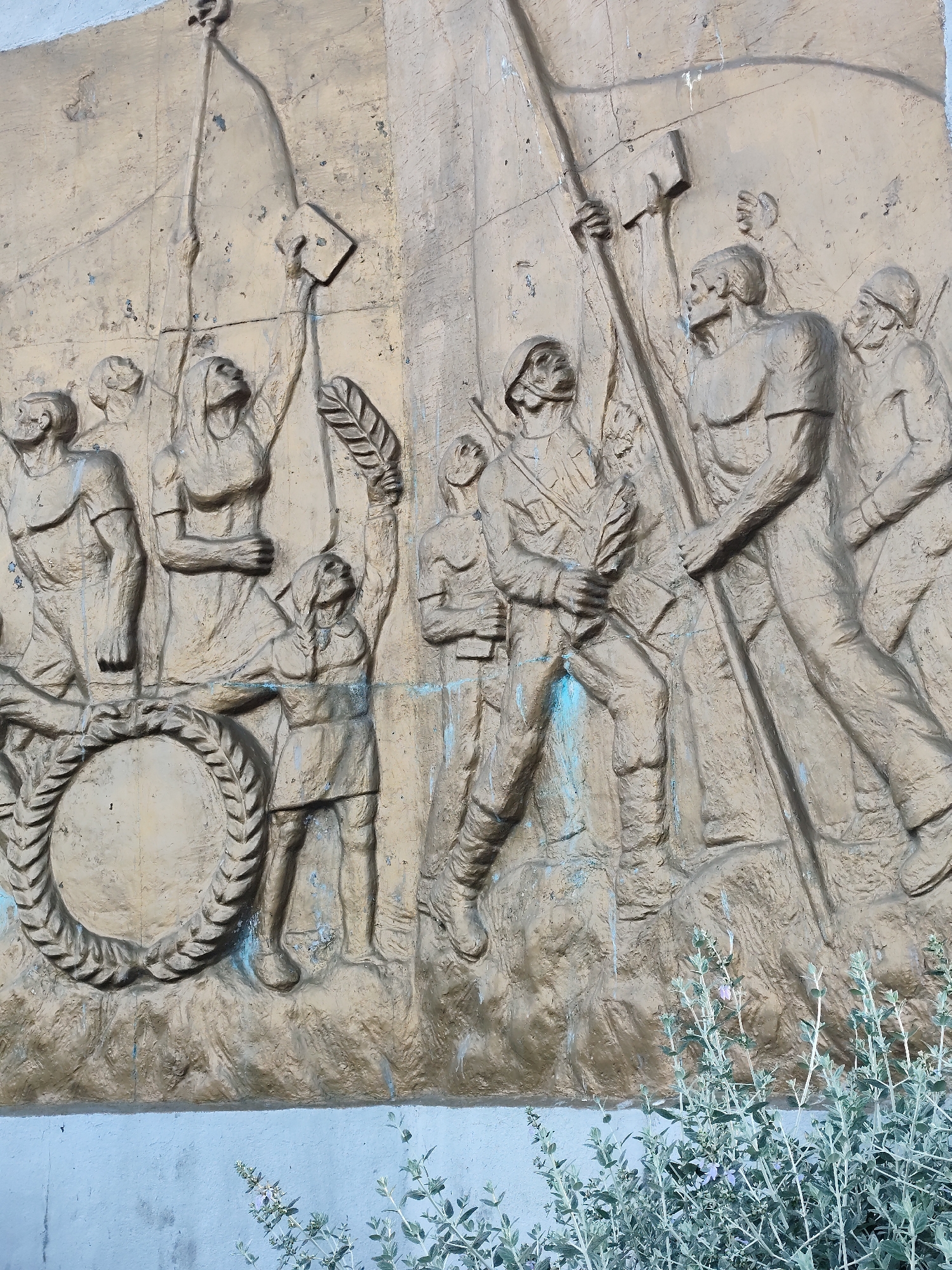 Witnesses document Atatürk monument with wreath in urban setting