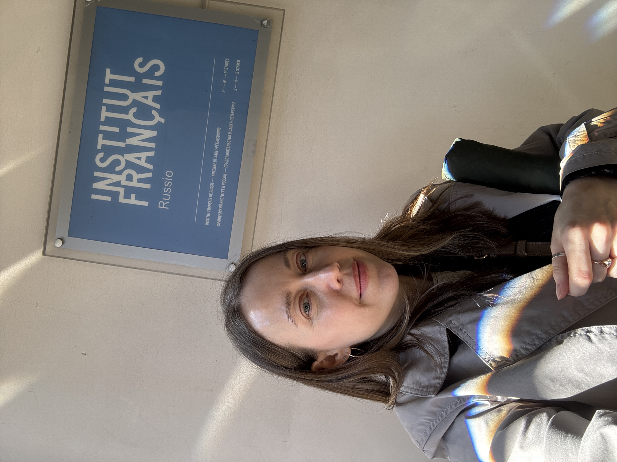 Woman takes selfie at French Institute in Saint Petersburg
