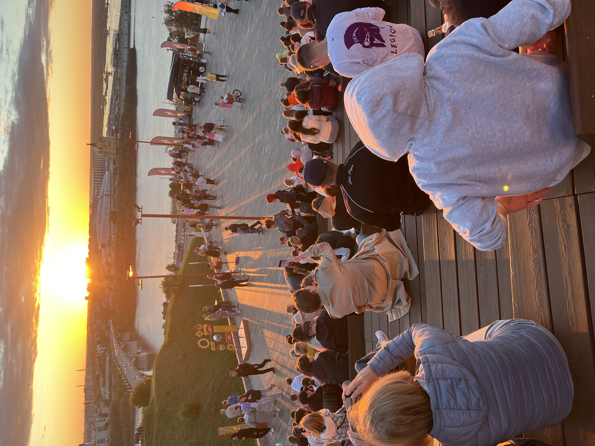 Live performances and crowds at Nizhny Novgorod's riverfront at sunset