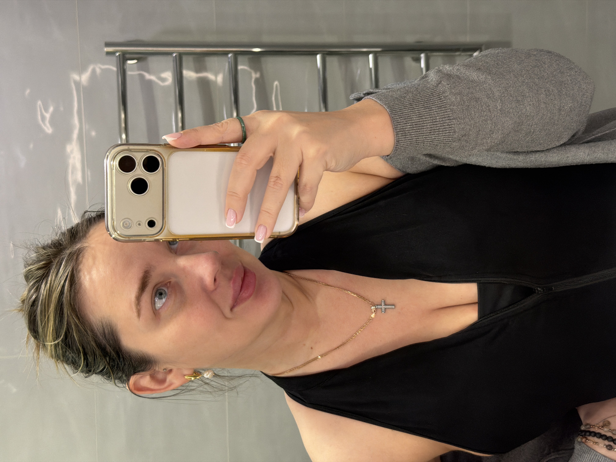 Woman takes selfies indoors in Dolgoprudny, Russia