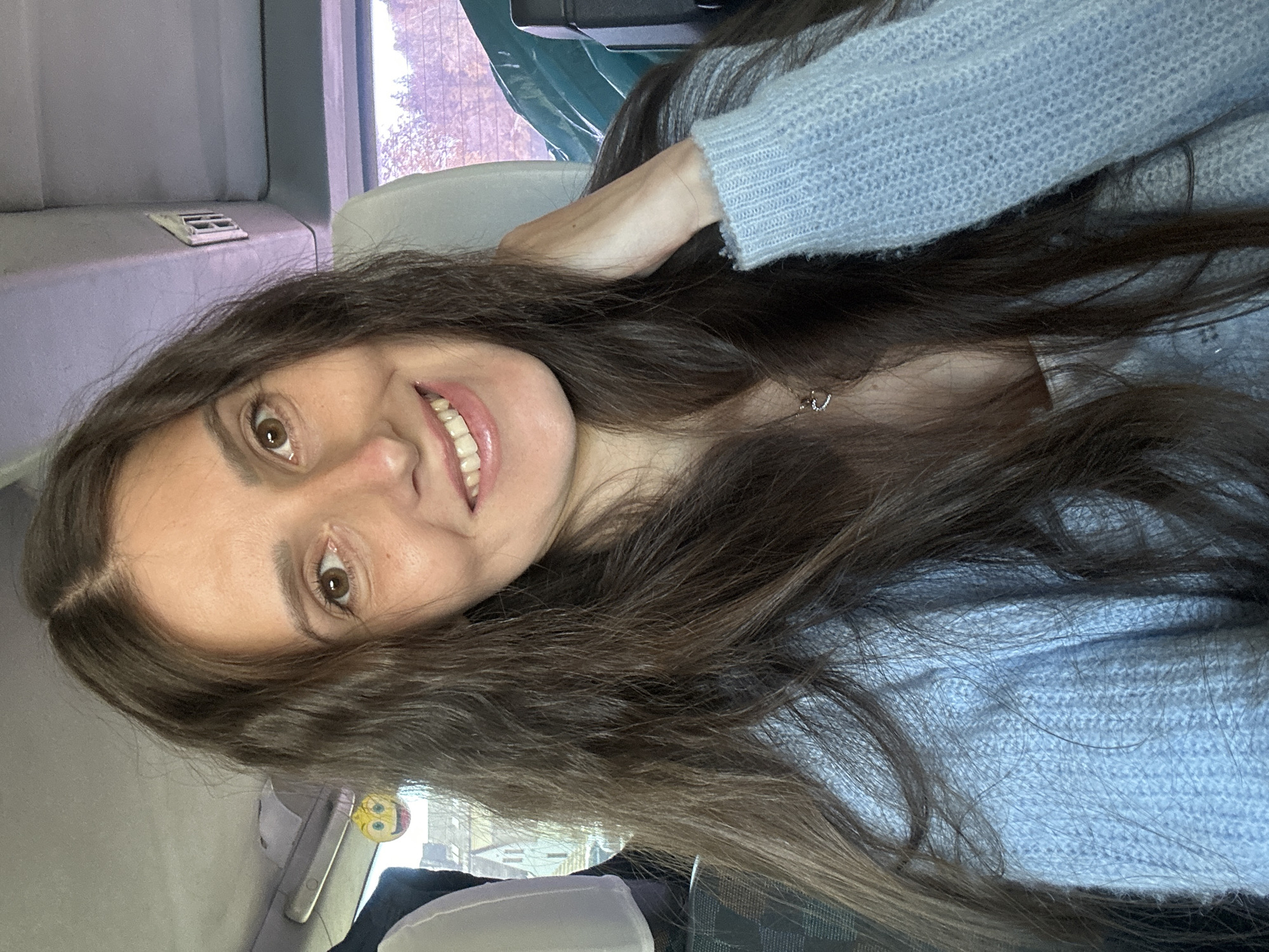Woman takes cheerful selfie in Wisła, Poland