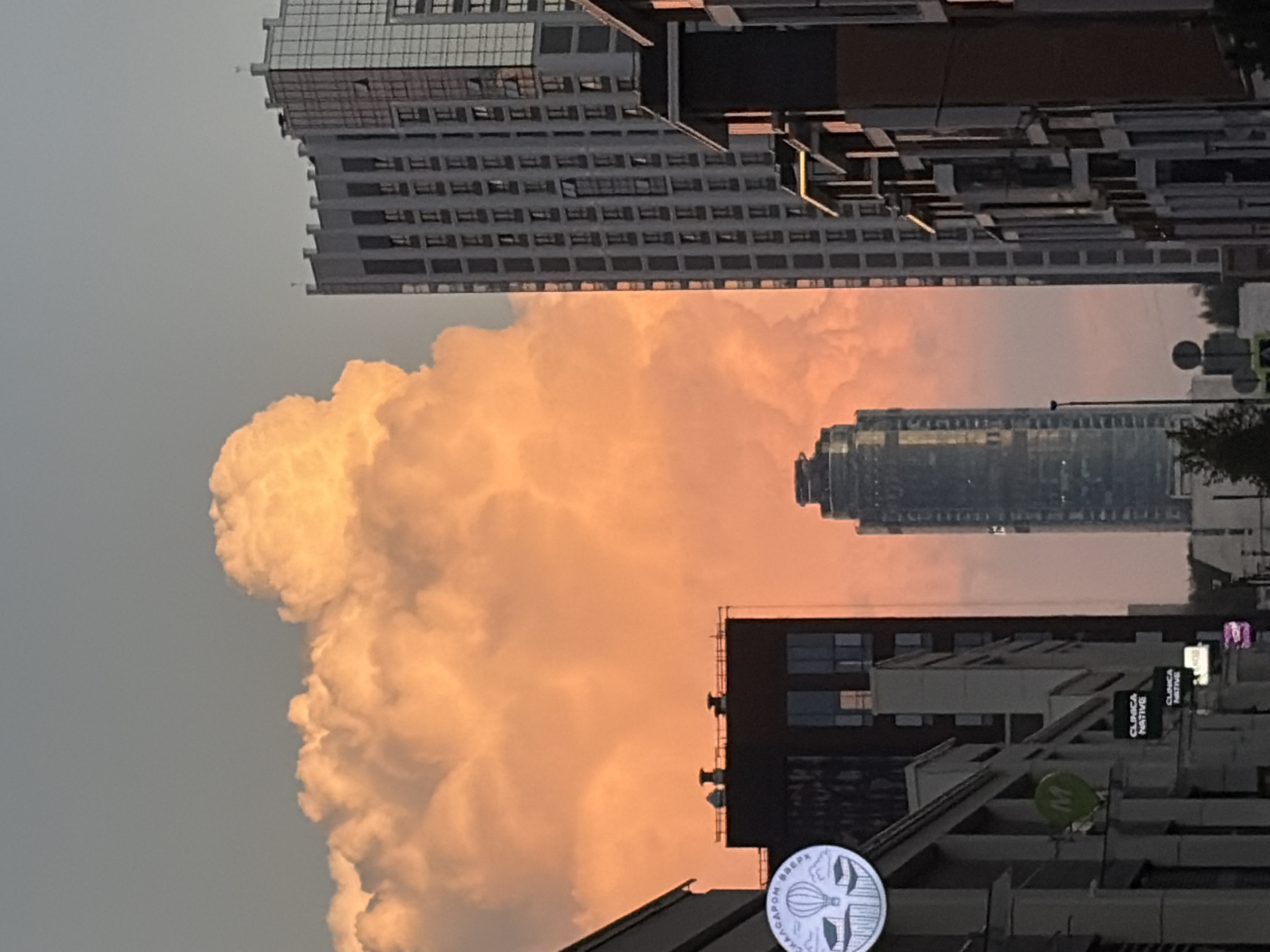 Soviet architecture, sunset clouds, and rooftop work in Yekaterinburg