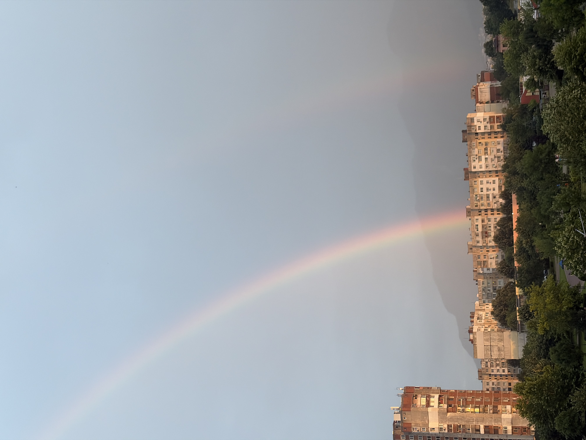 Rainbow over Vratsa's Soviet-era skyline, July evening