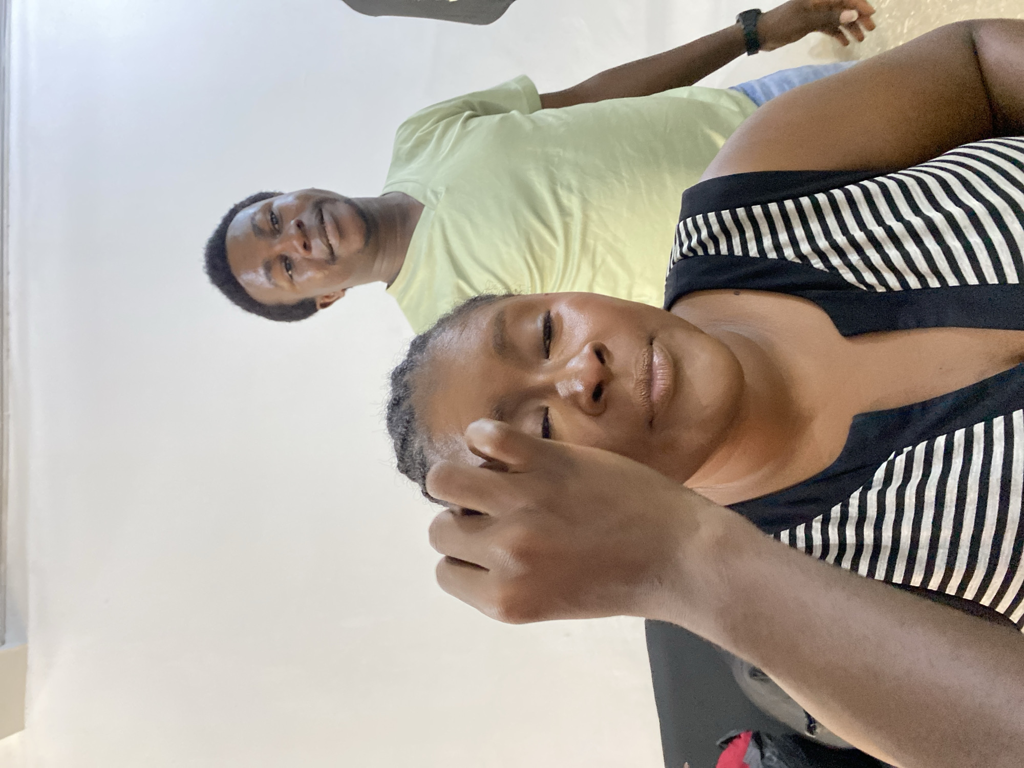 Woman receives makeup application in Gura Top, Nigeria