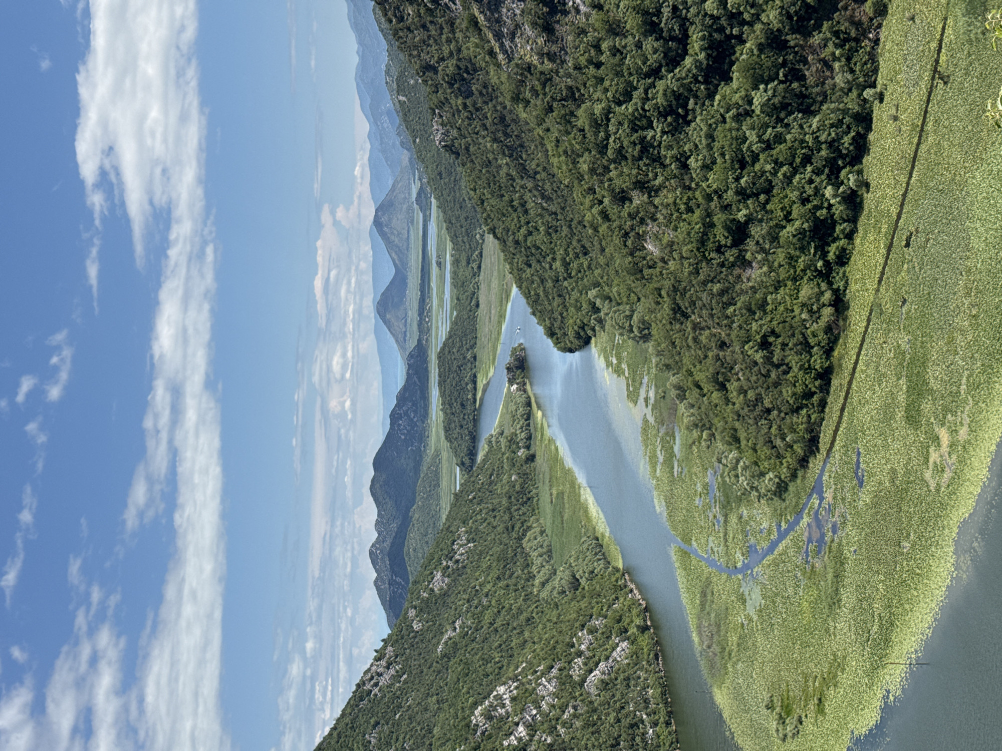Witnesses document scenic lake landscapes with historic stone structures