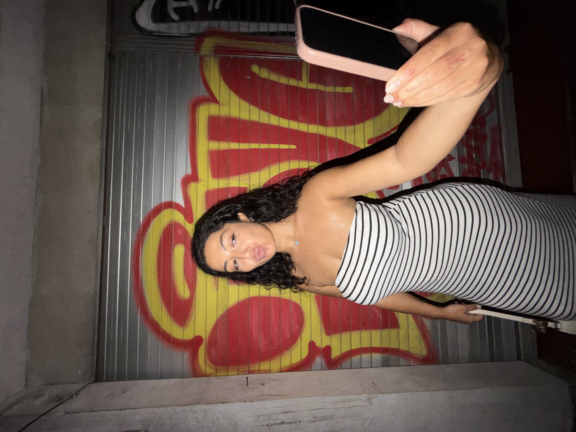 Nighttime photoshoot against graffiti walls in Mengwi, Indonesia