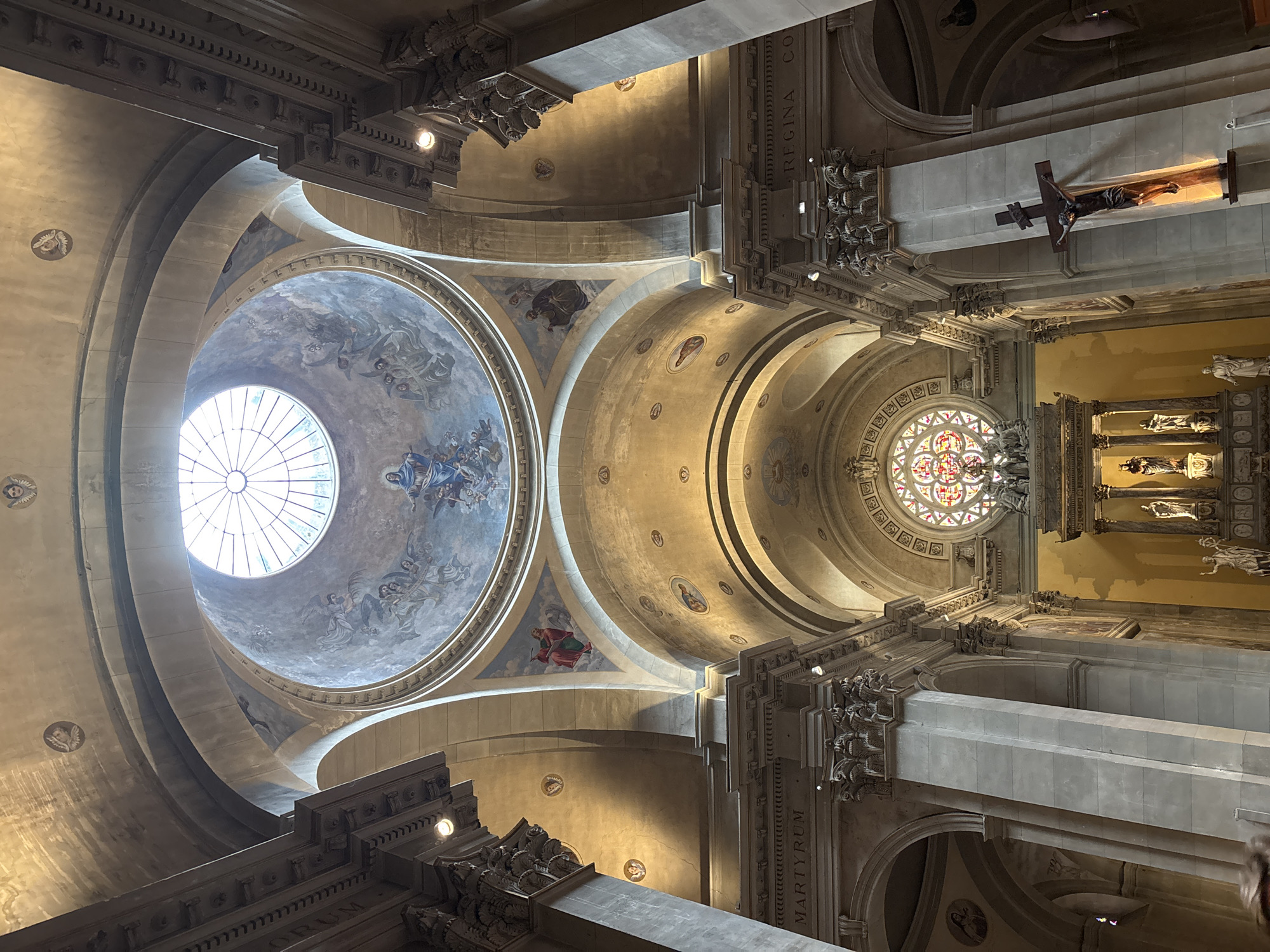 Tourist photographs historic church interior and exterior in Annecy