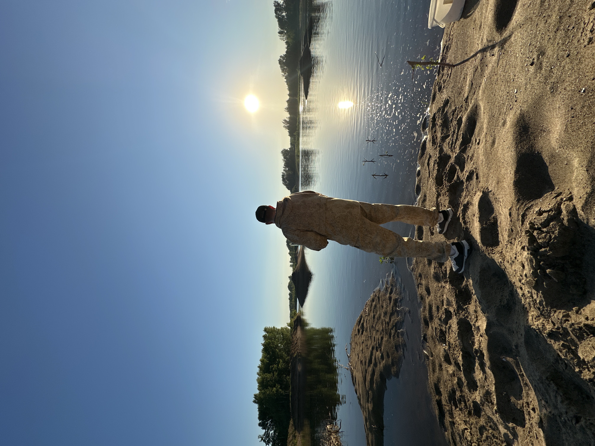 Fishing on a calm Russian riverbank at golden hour