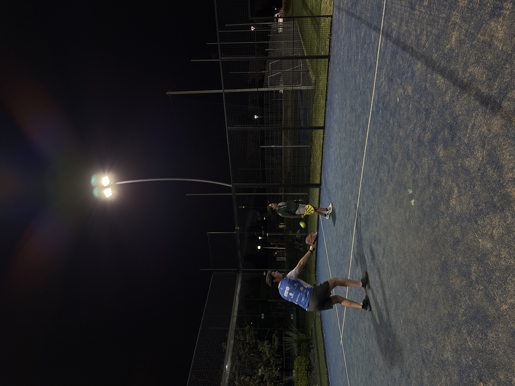 Late-night paddle tennis game captured in Puebla, Mexico