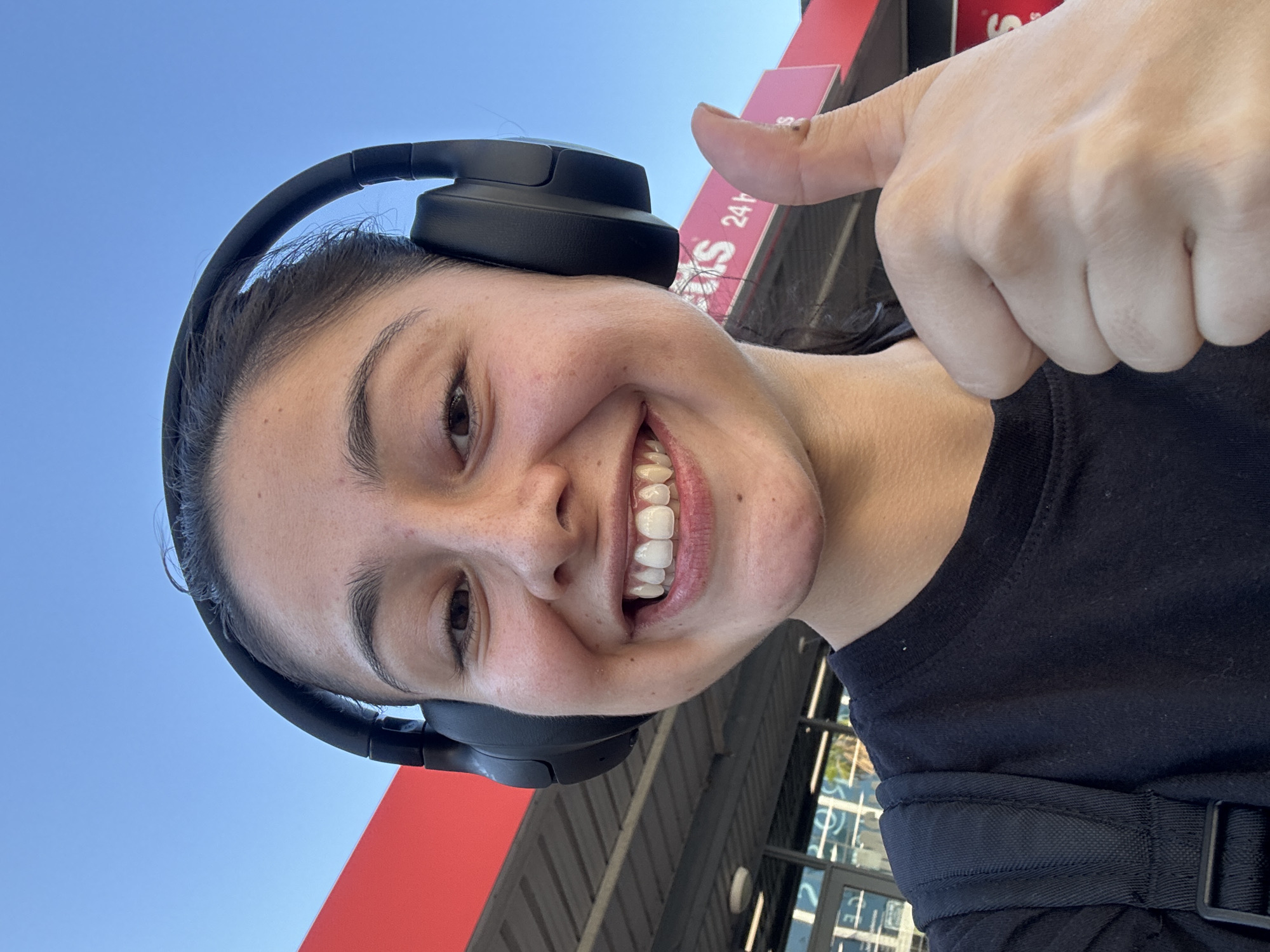 Woman takes cheerful selfie outdoors in Applecross