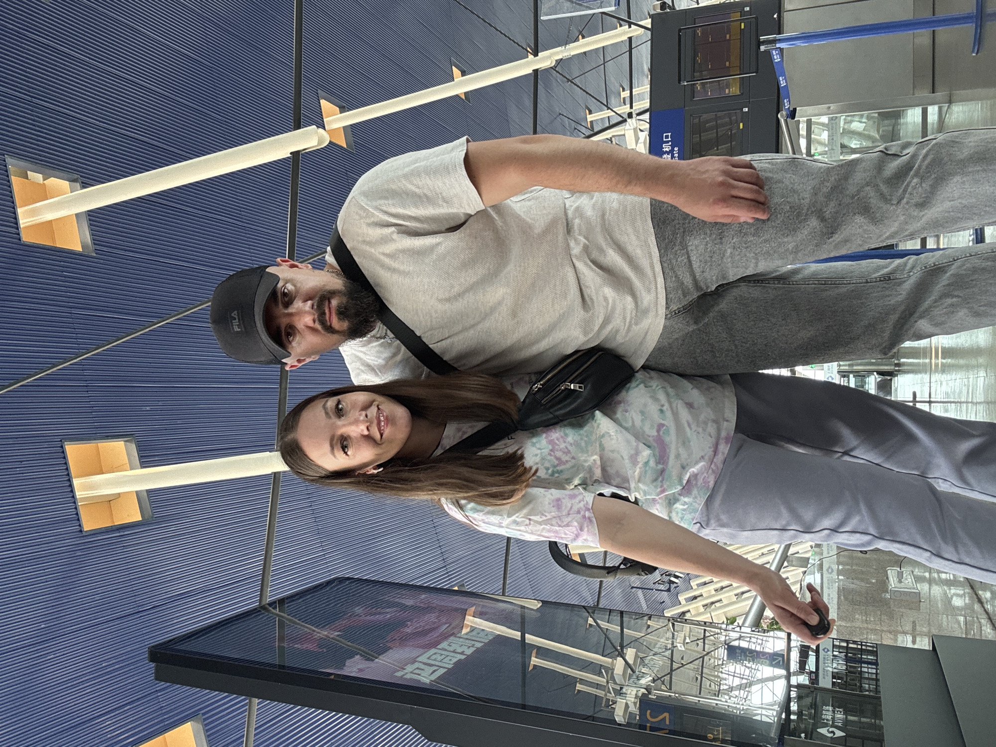 Couple photographs at Shanghai Pudong Airport early morning