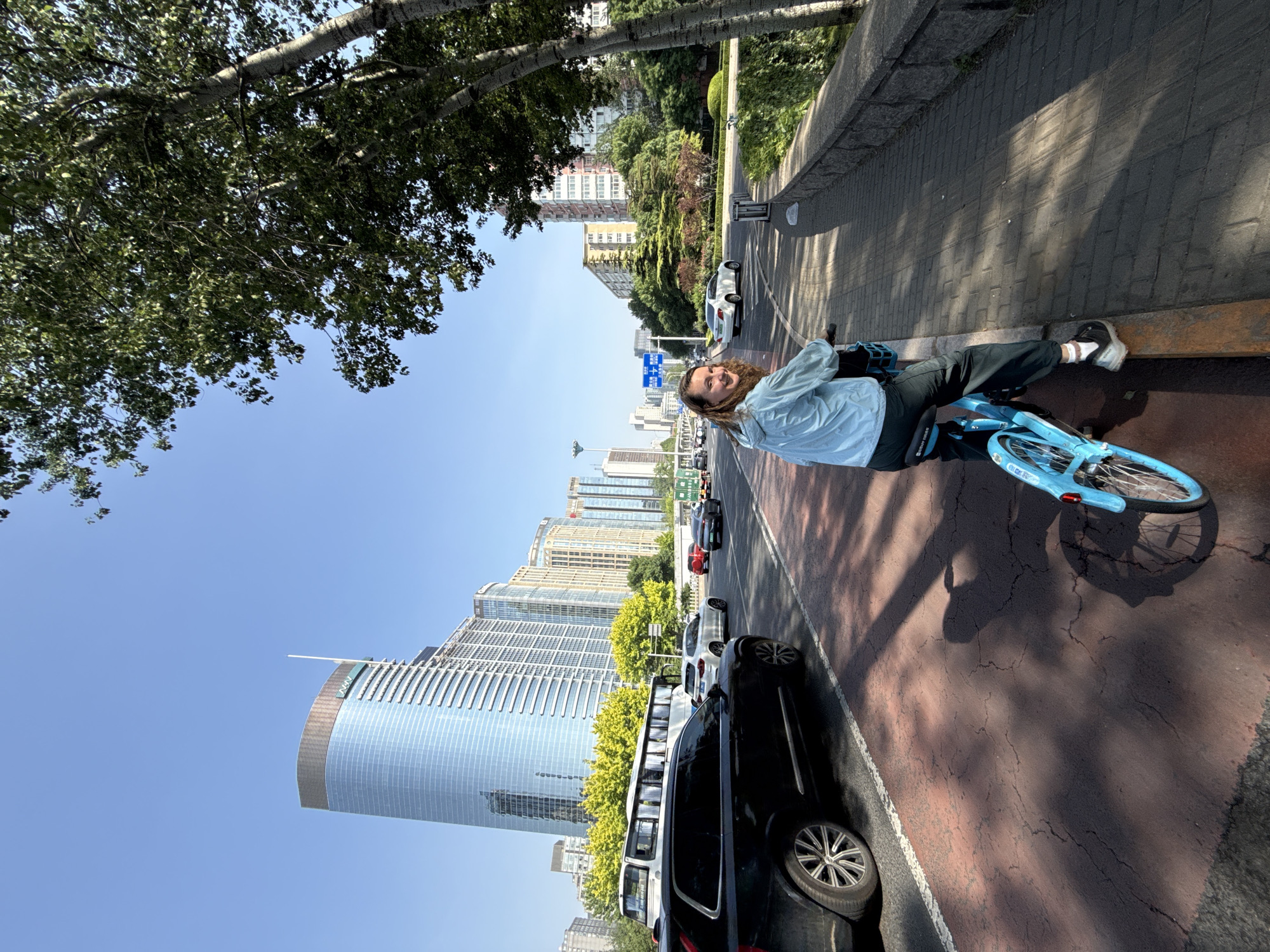 Woman with bicycle observed during Beijing traffic jam