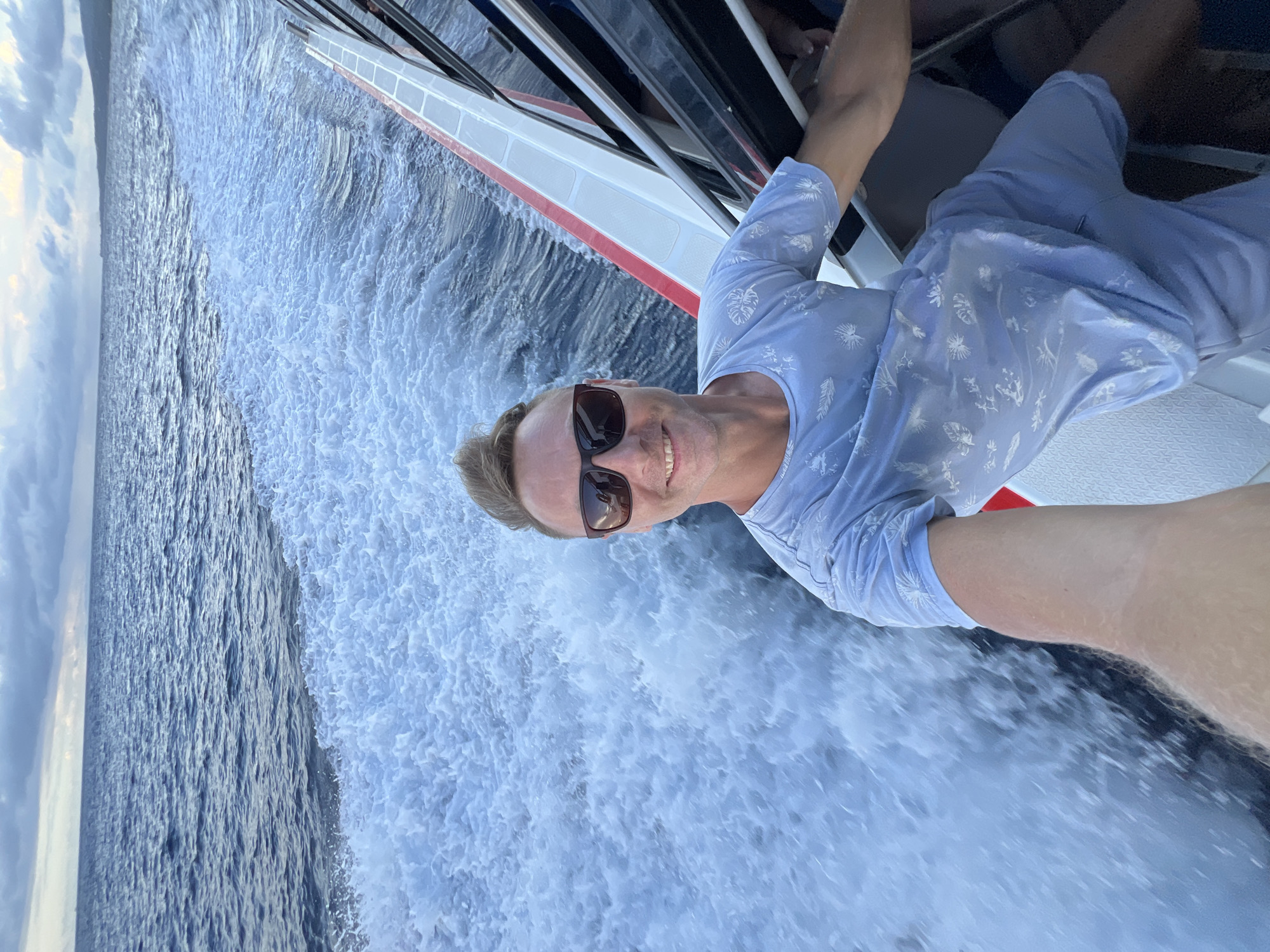 Tourist documents boat journey near Nusa Penida with selfies